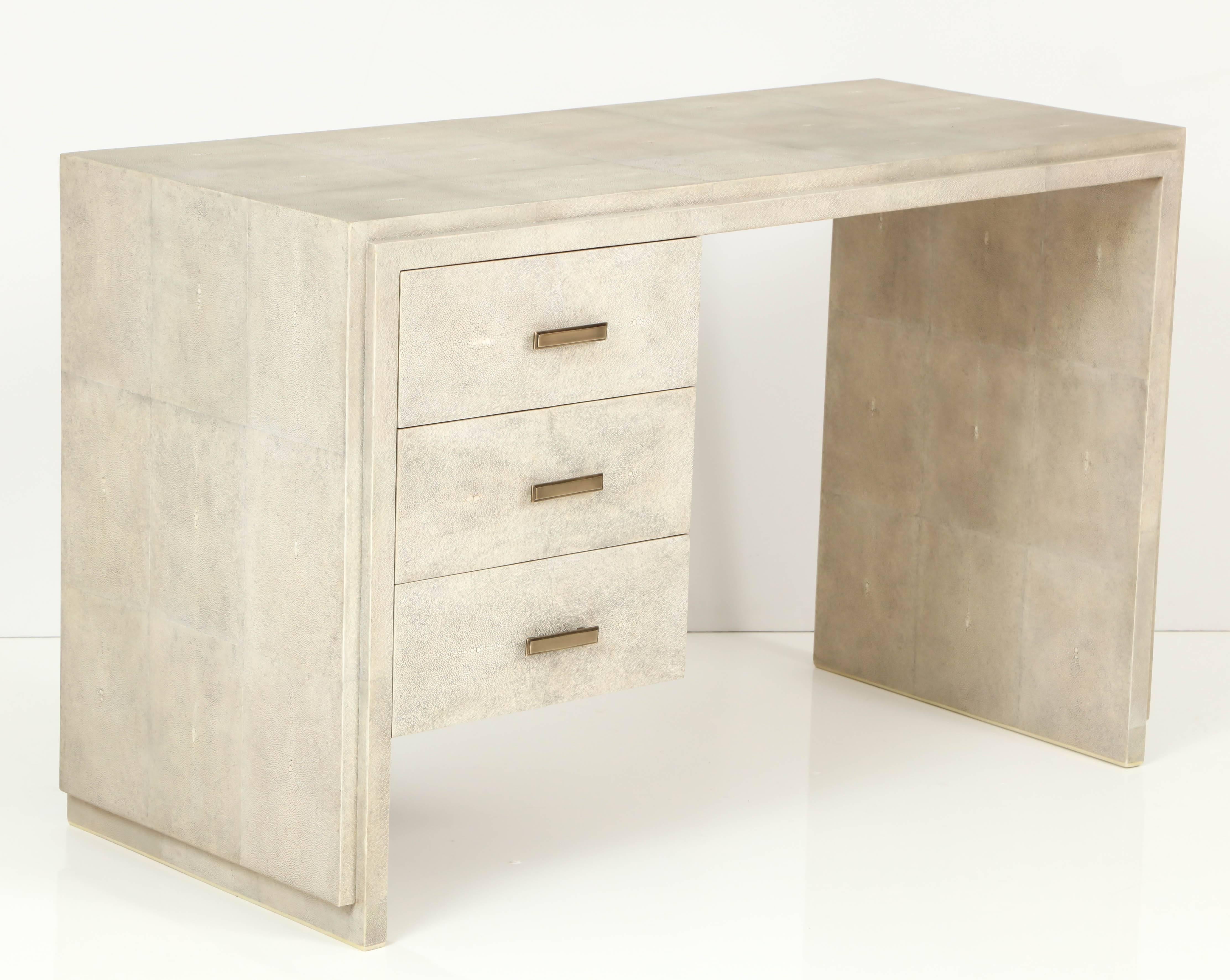 Decorative cream shagreen desk with three drawers from France.