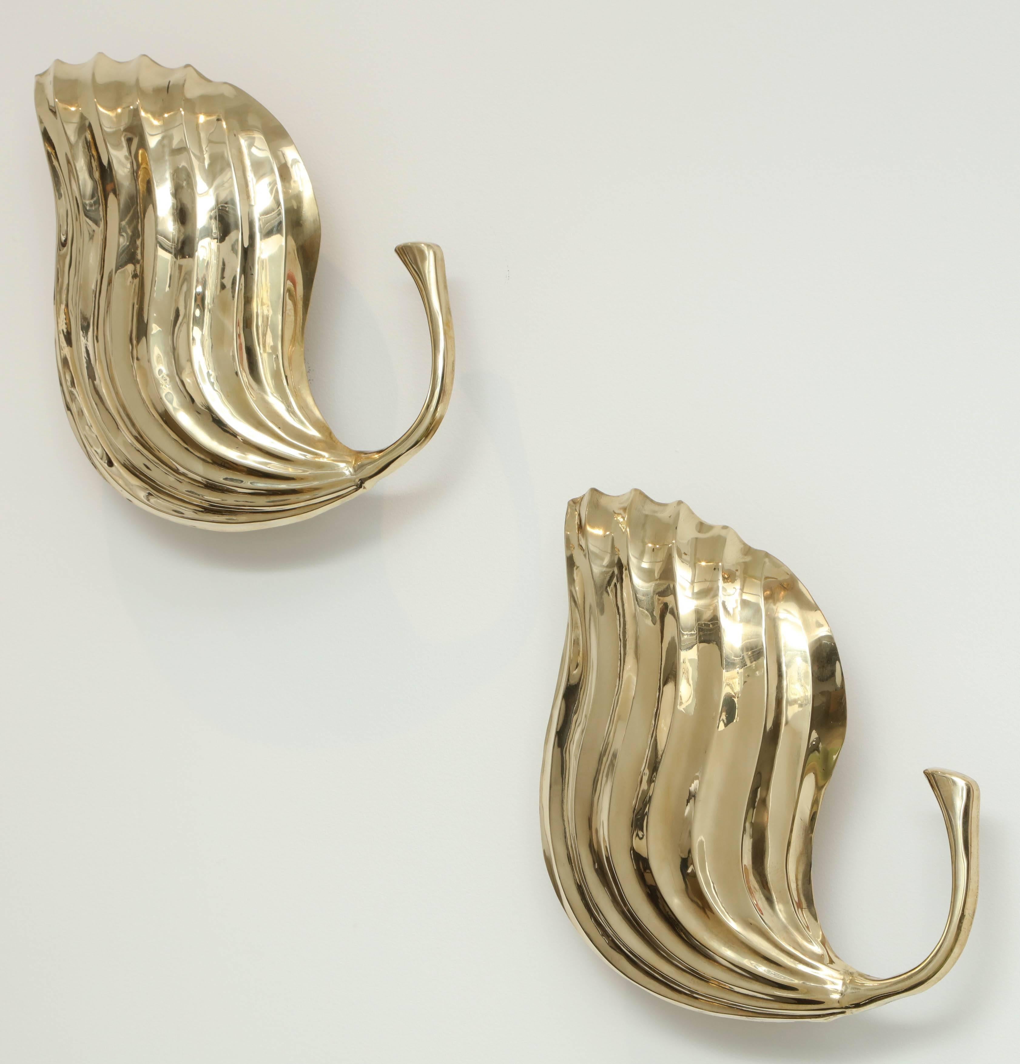Italian hand-forged brass leaf sconces by Tomasso Barbi, 1970s. Newly repolished and rewired for US usage.