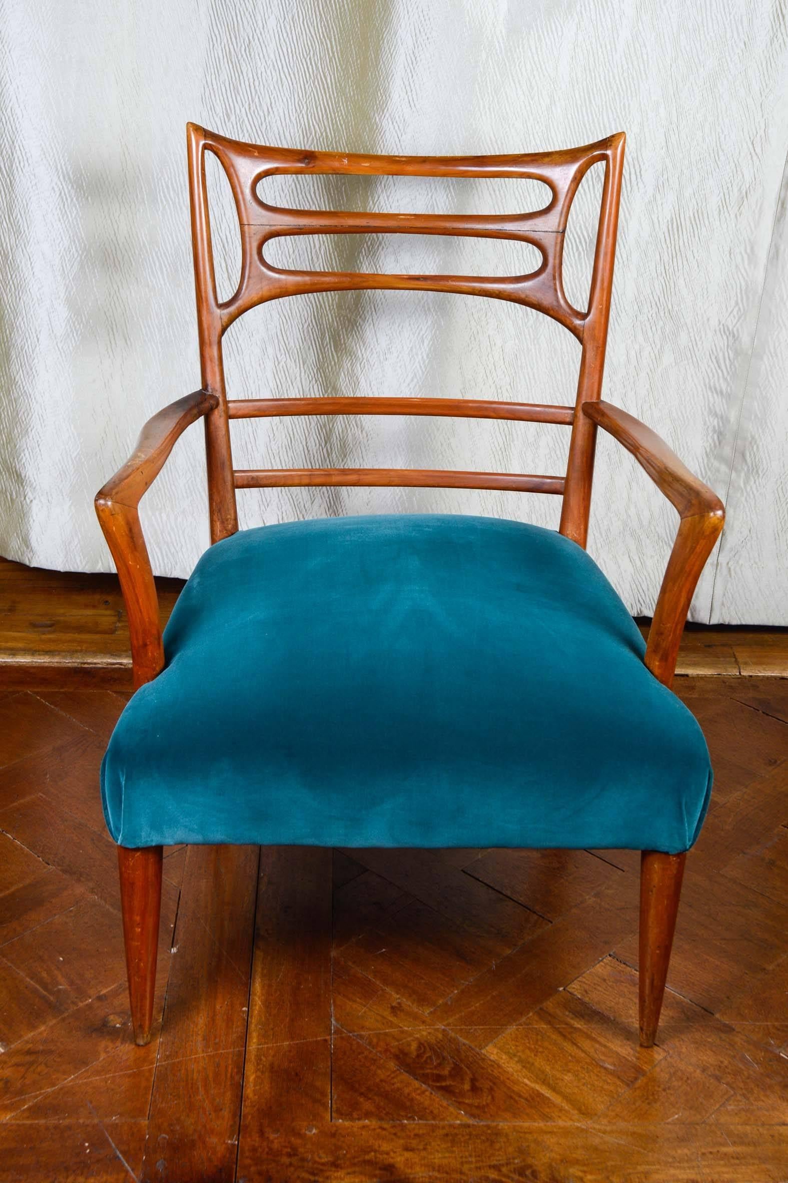 Pair of vintage armchairs, seat upholstered with blue velvet, sculpted back in wood.