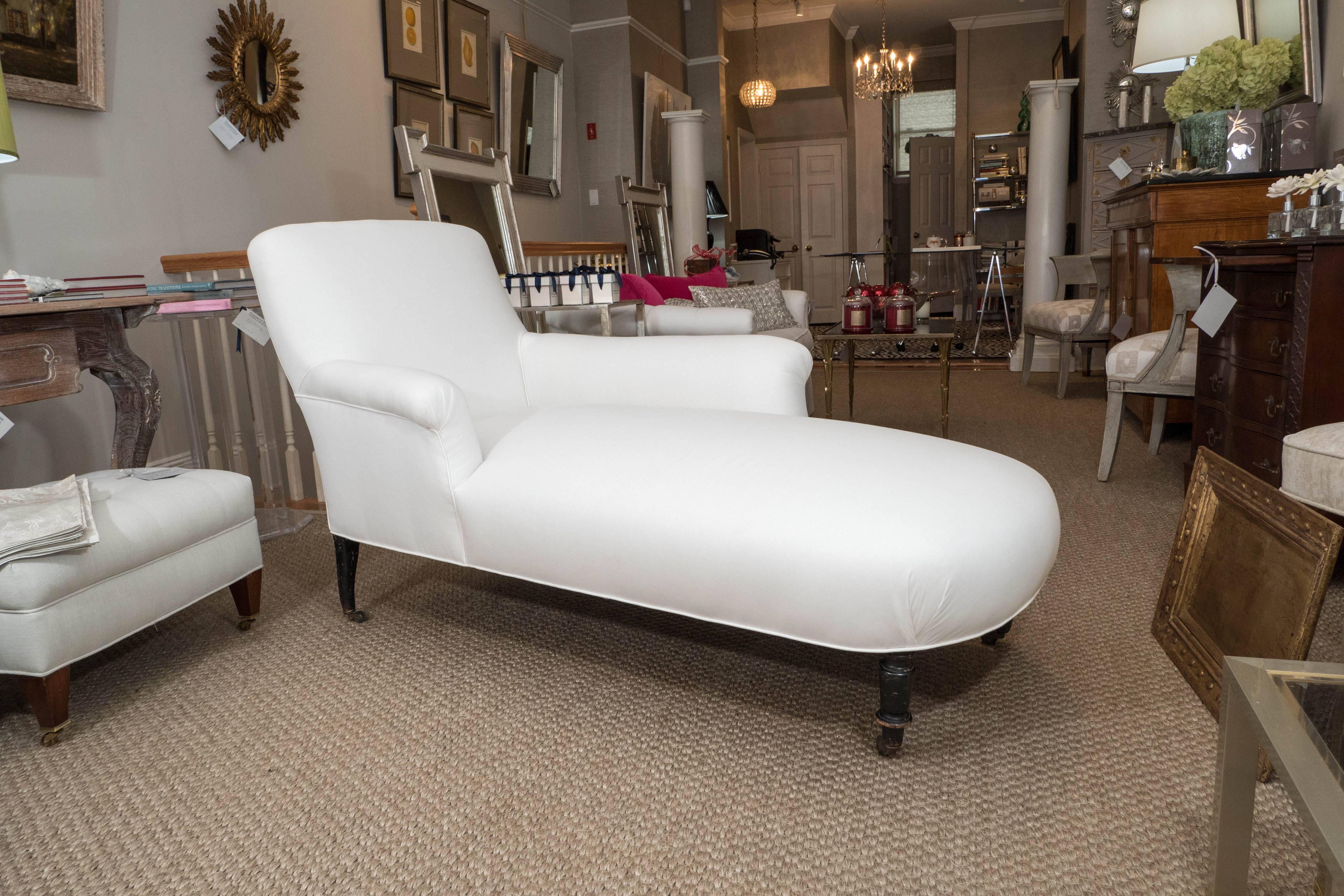 An elegant and graceful Napoleon III chaise (a la Meridienne) with turned front legs on casters, ca. 1860.

