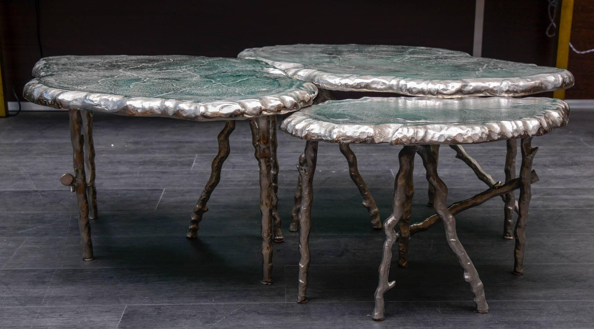Cast aluminium tables.

Dimensions for the single small one: 53 x 32 x 34 cm.