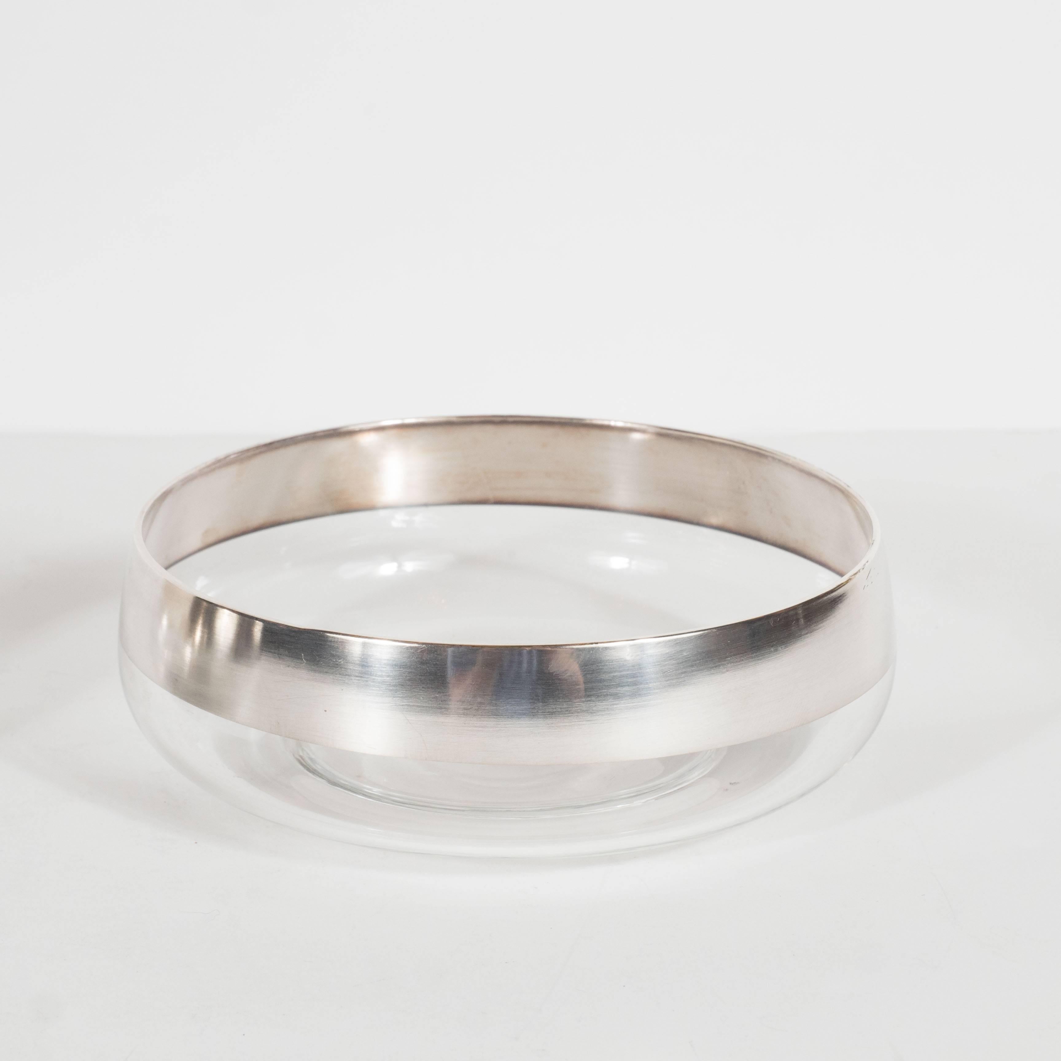 A pair of Mid-Century sterling silver overlay-banded bowls by Dorothy Thorpe. Each bowl features a 1-inch band of silver overlay along the outer perimeter of each bowl. This iconic design of Dorothy Thorpe's in excellent condition,

American,