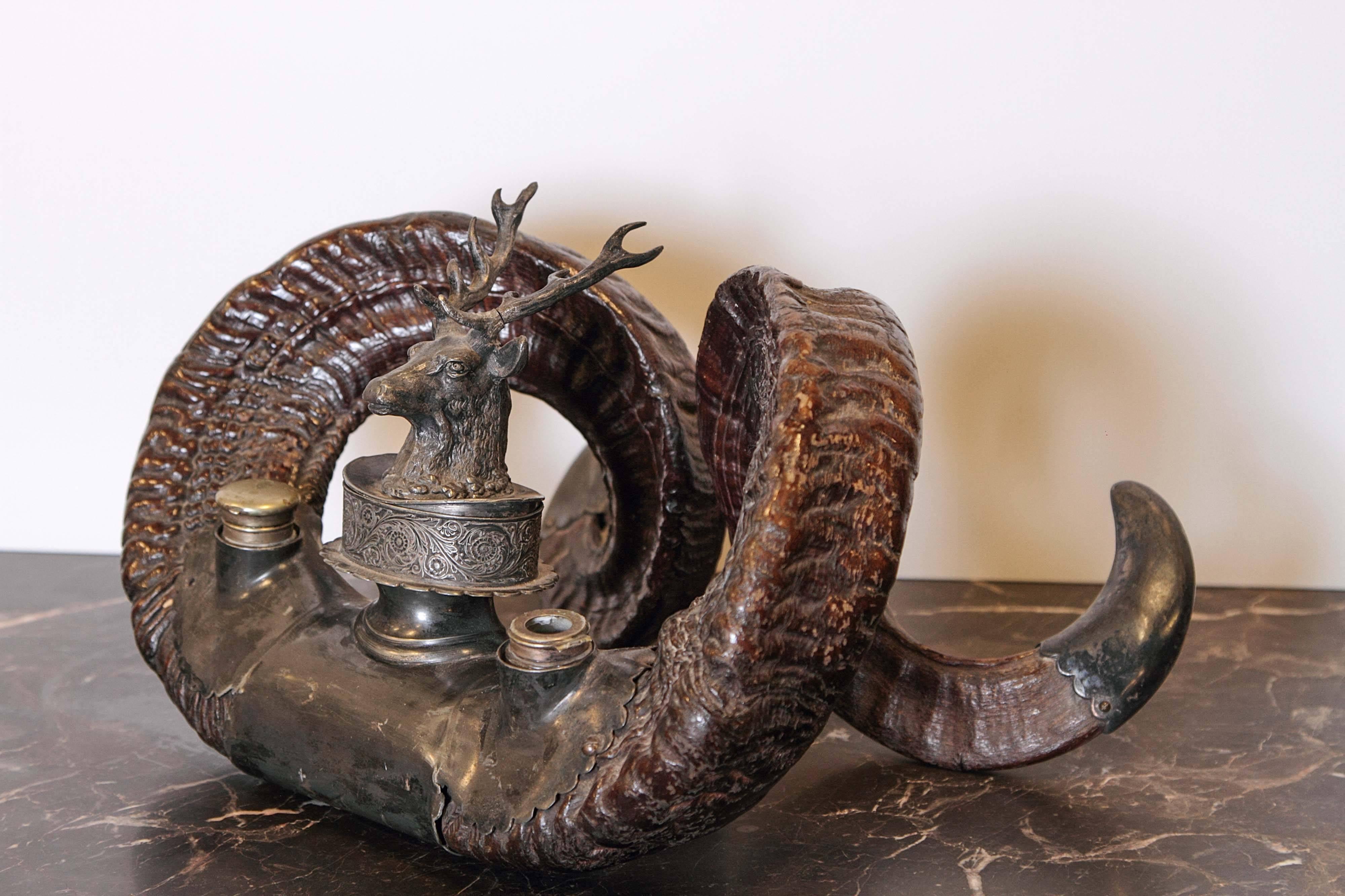 19th century English rams Horn inkwell with pewterl mounts and brass topped bottles.