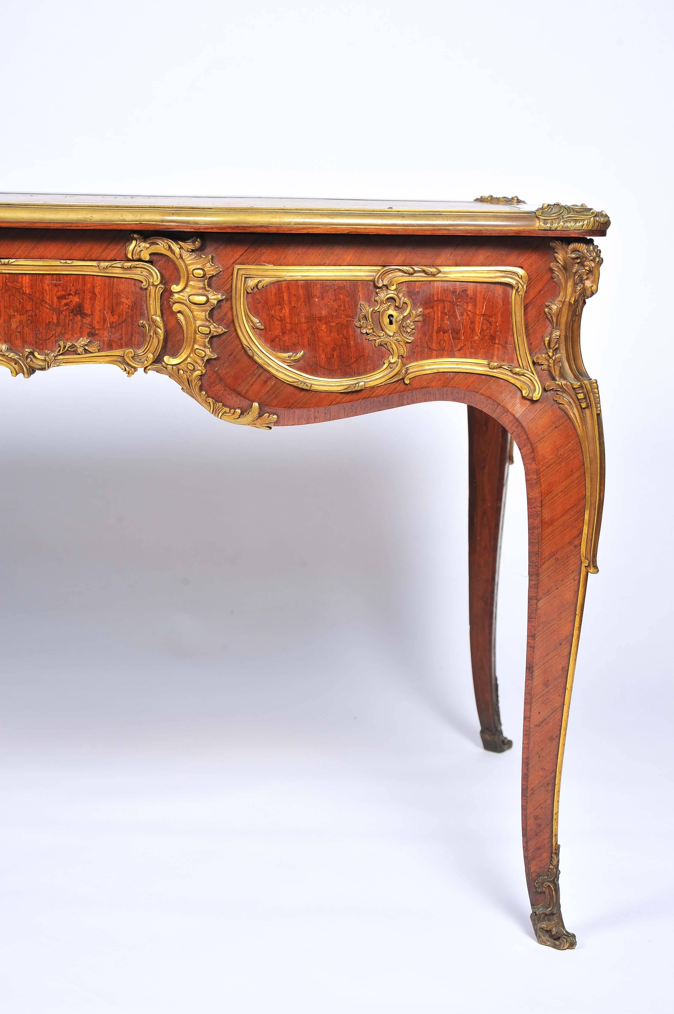 A fine quality 19th century Louis XV style, ormolu-mounted, kingwood bureau plat, stamped 'Zwiener'
Having an inset leather top, three frieze drawers with dummy drawers to the reverse side. Marquetry inlaid panels and raised on elegant