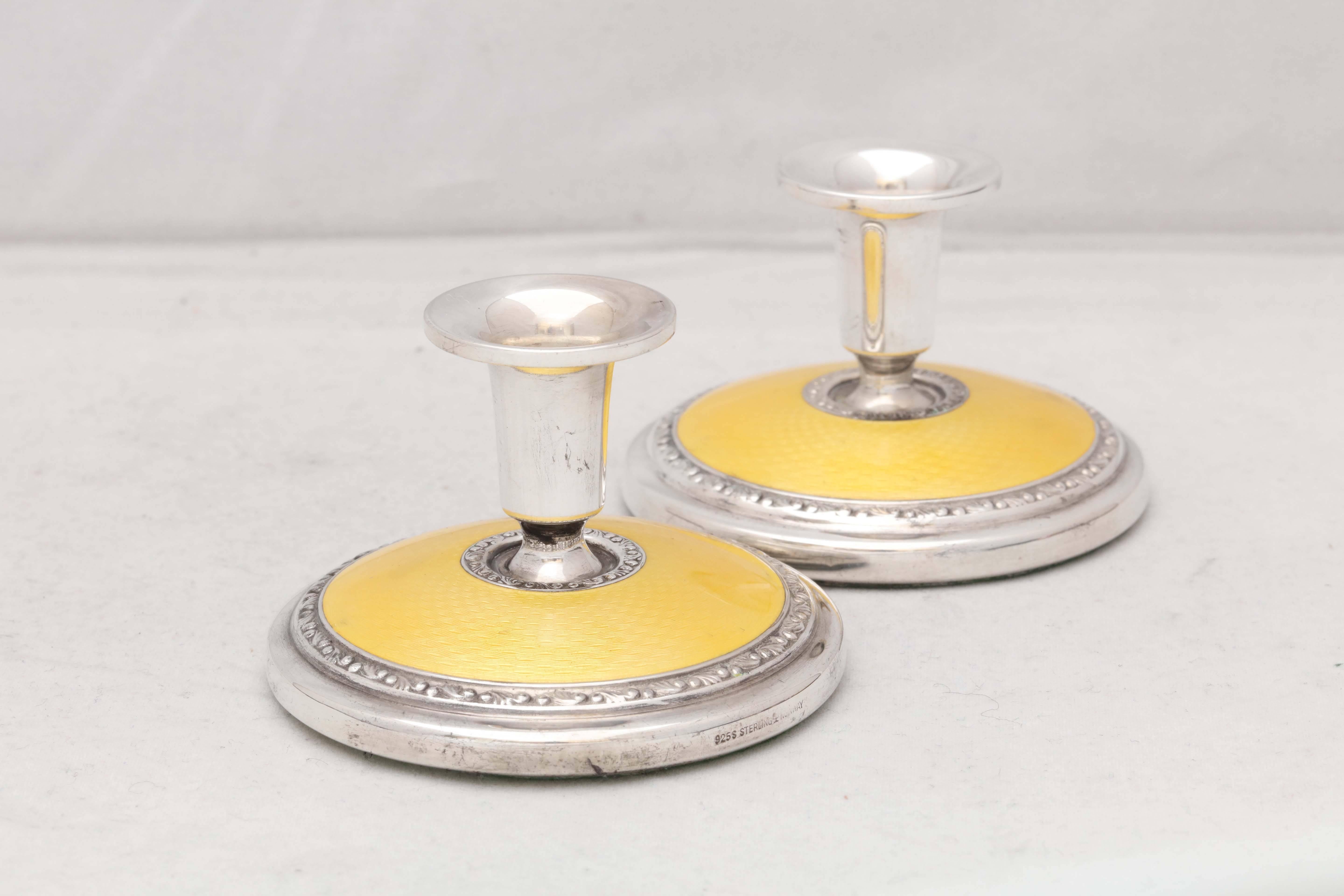 Norwegian Pair of Art Deco Sterling Silver and Yellow Guilloche Enamel Candlesticks