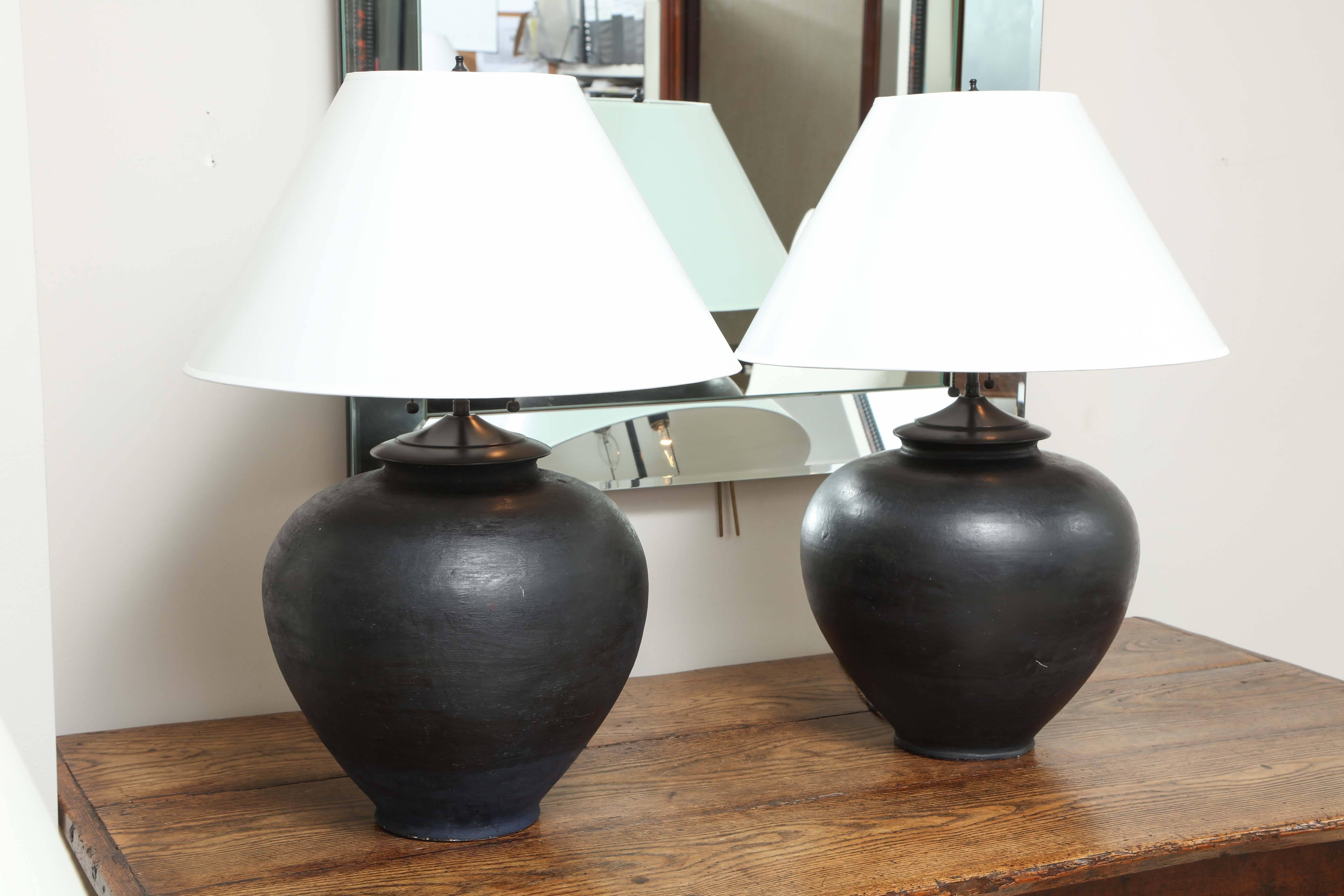 Pair of late 19th century terracotta wine vessel lamps, black glaze
Chinese.