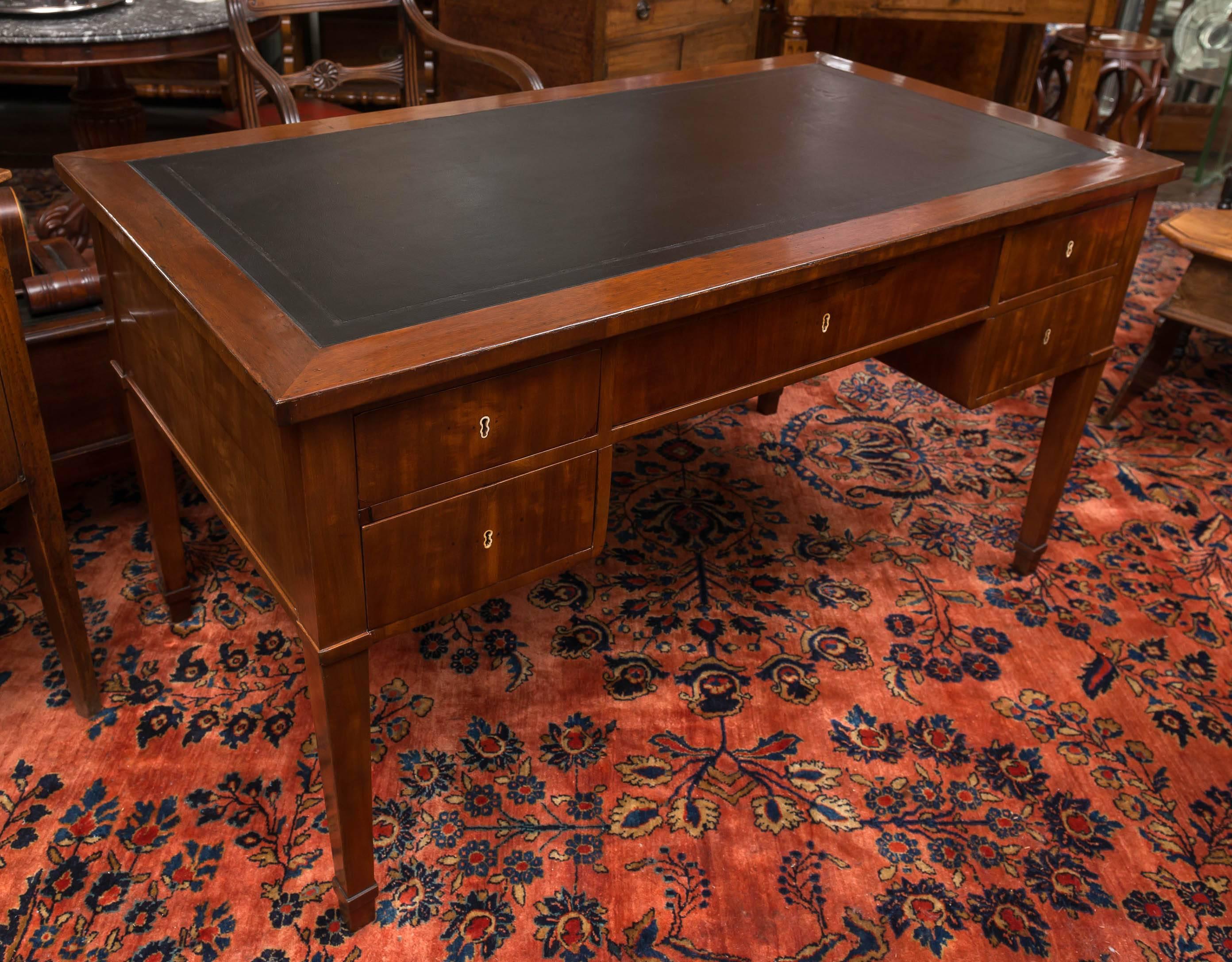 19th century Biedermeier mahogany, leather top wring table or desk, circa 1835
Fitted with five deep drawers all working smoothly. A set of original keys are included. The sides and drawers are constructed of matched and figured vertical veneers