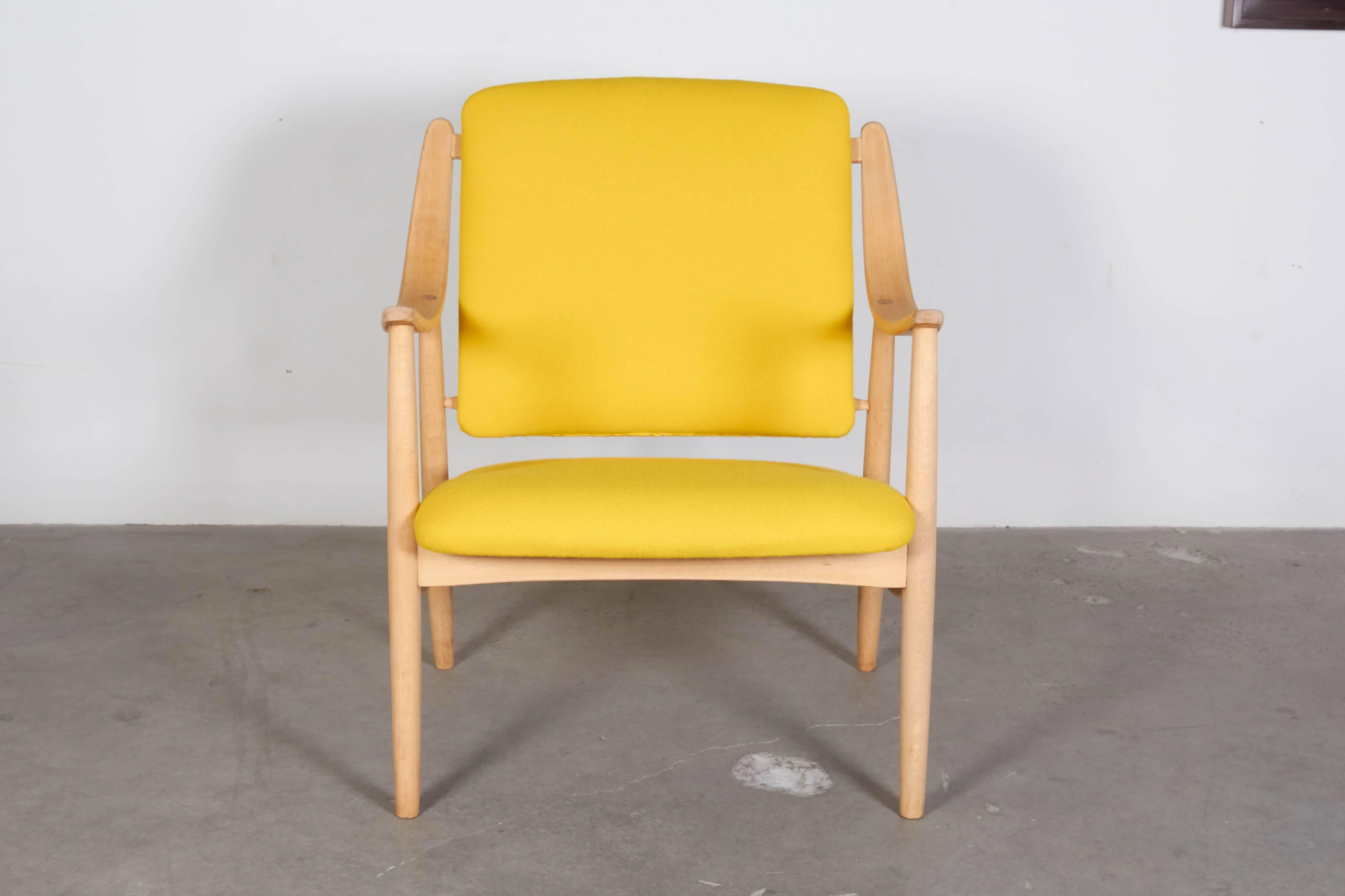 Vintage 1950s Torbjorn Afdal Oak Armchair 

This Danish Modern armchair is in like new condition. The oak has a soap finish, and is newly upholstered in this yellow Irish wool. Ready for pick up, delivery or shipping anywhere in the world.
 