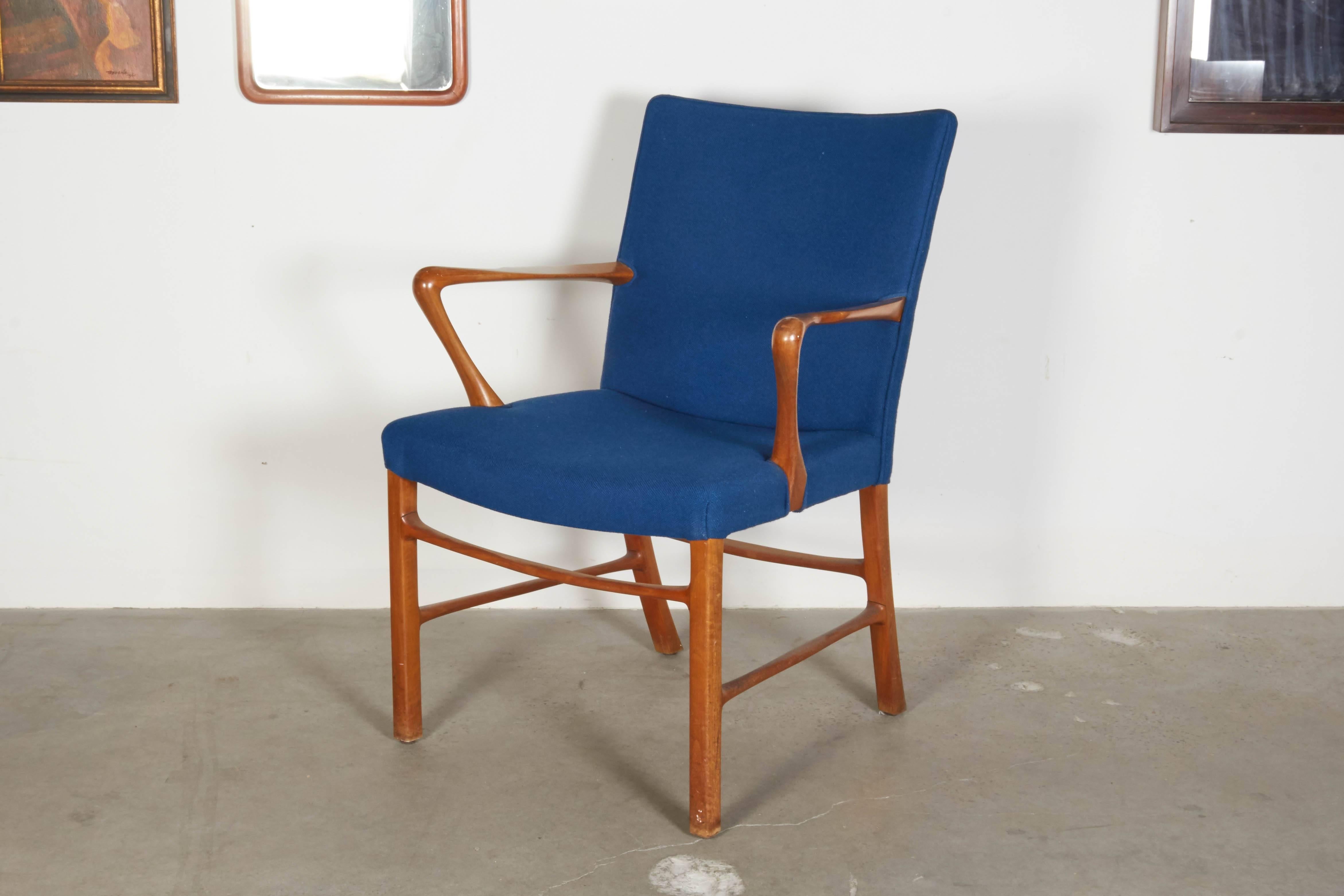 Vintage 1950s Danish Modern occasional armchairs.

These Mid-Century armchairs are in excellent condition. Love the organic style of the cross bars and arms. Blue wool fabric is in great condition. We can also reupholster for you for a fee.