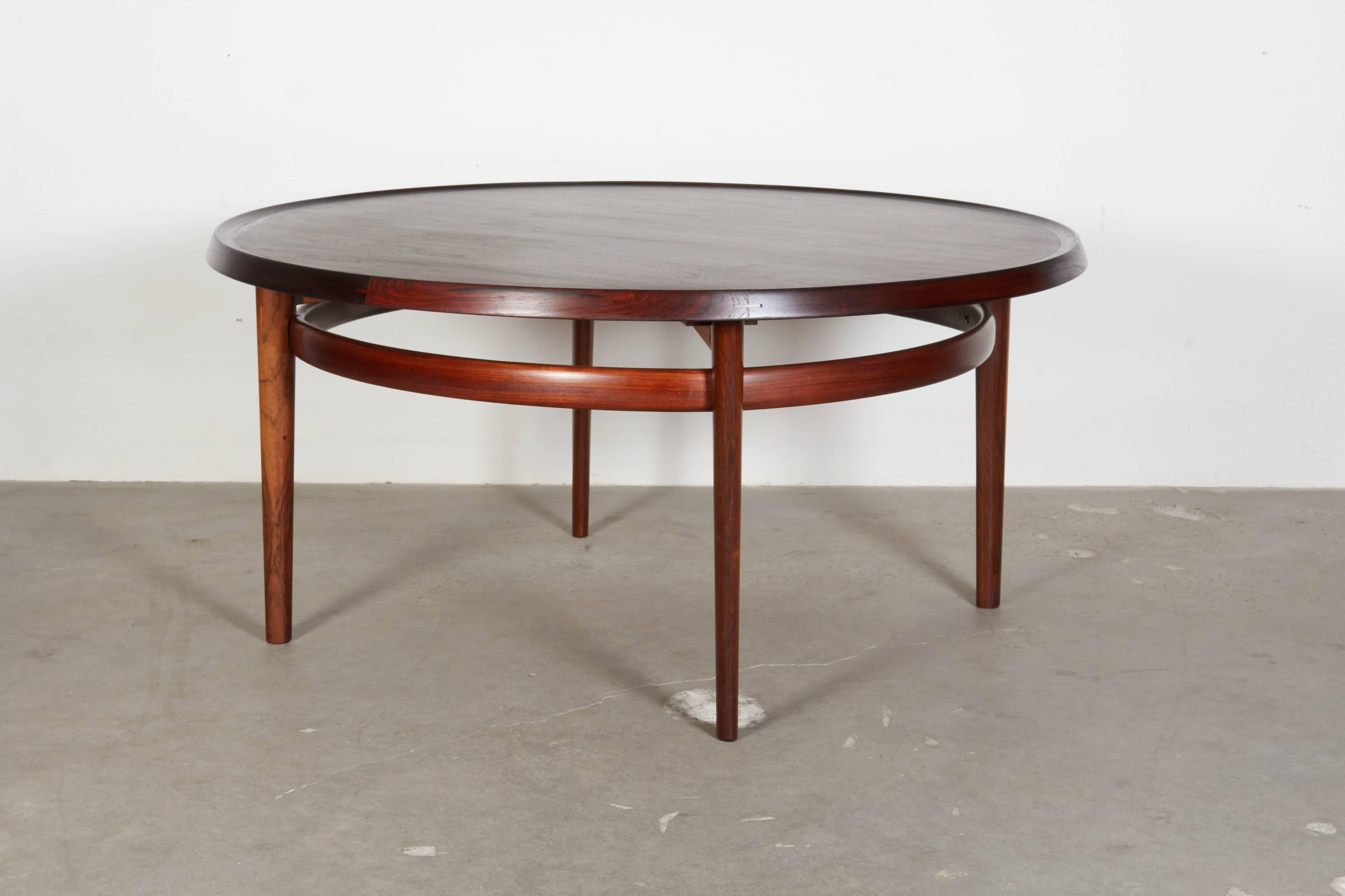 Vintage 1960s Round Rosewood Coffee Table by Torbjørn Afdal

This Norwegian coffee table is lovely and is generally in excellent condition. In picture number six you can see a small blemish along the inner lip of the table. The blemish isn't bad.