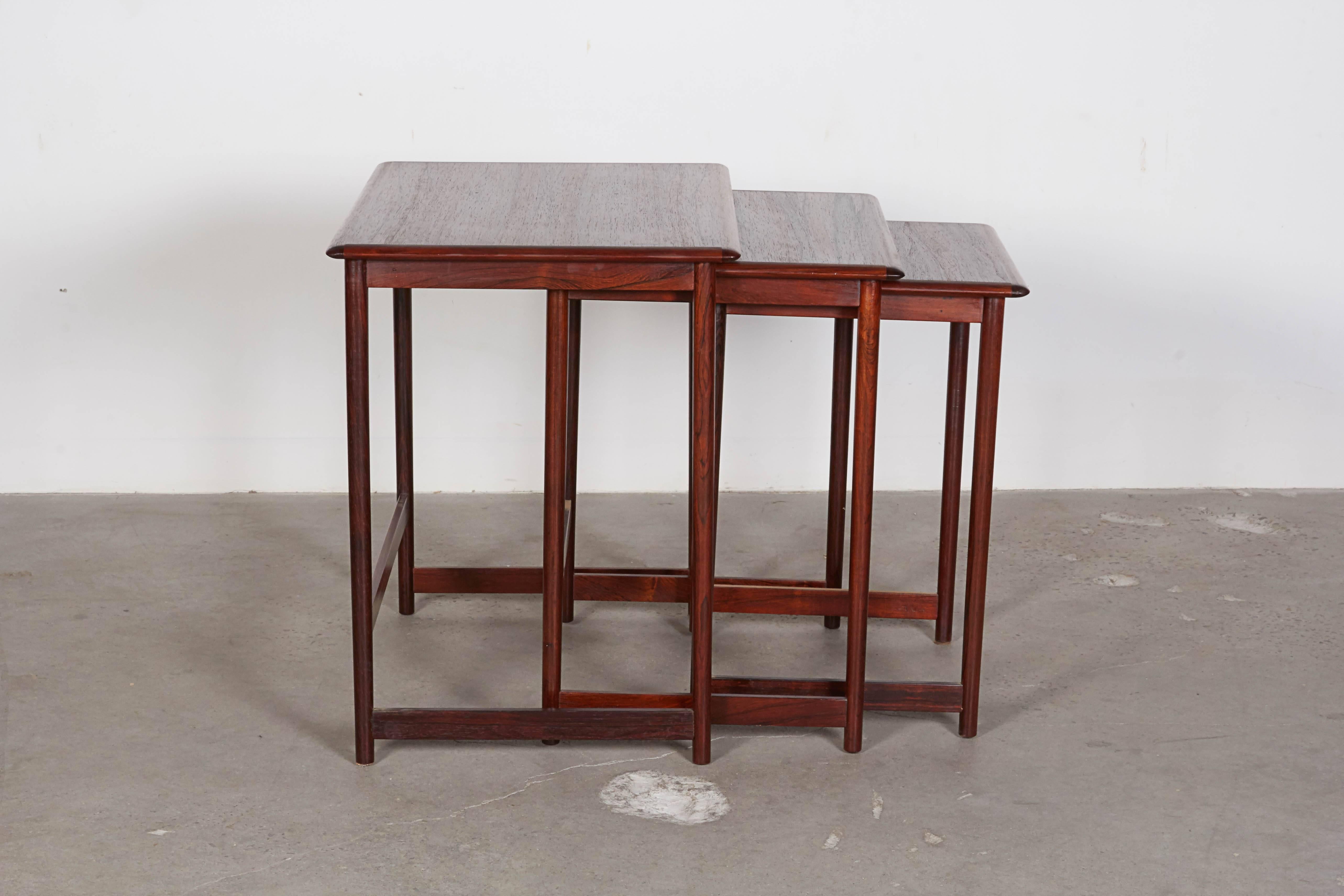 Vintage 1960s Norwegian nesting tables in rosewood.

This set of Danish modern nesting tables are in like-new condition. Nesting tables are incredibly useful the way they can be stored in the corner can free you from the need of a coffee table