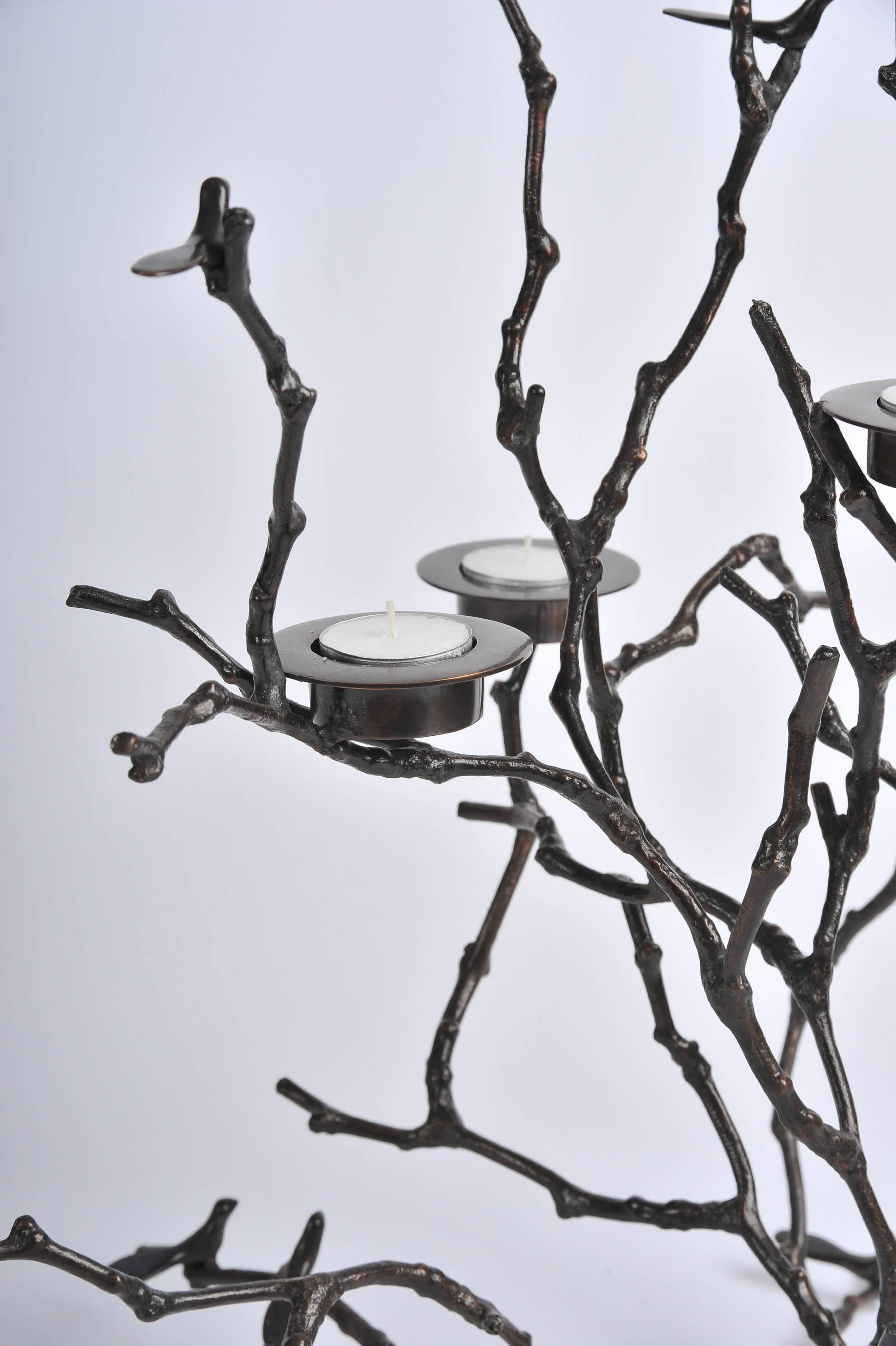 Handmade cast bronze. Tiny birds and candle holders nestle in delicate cast bronze twigs.