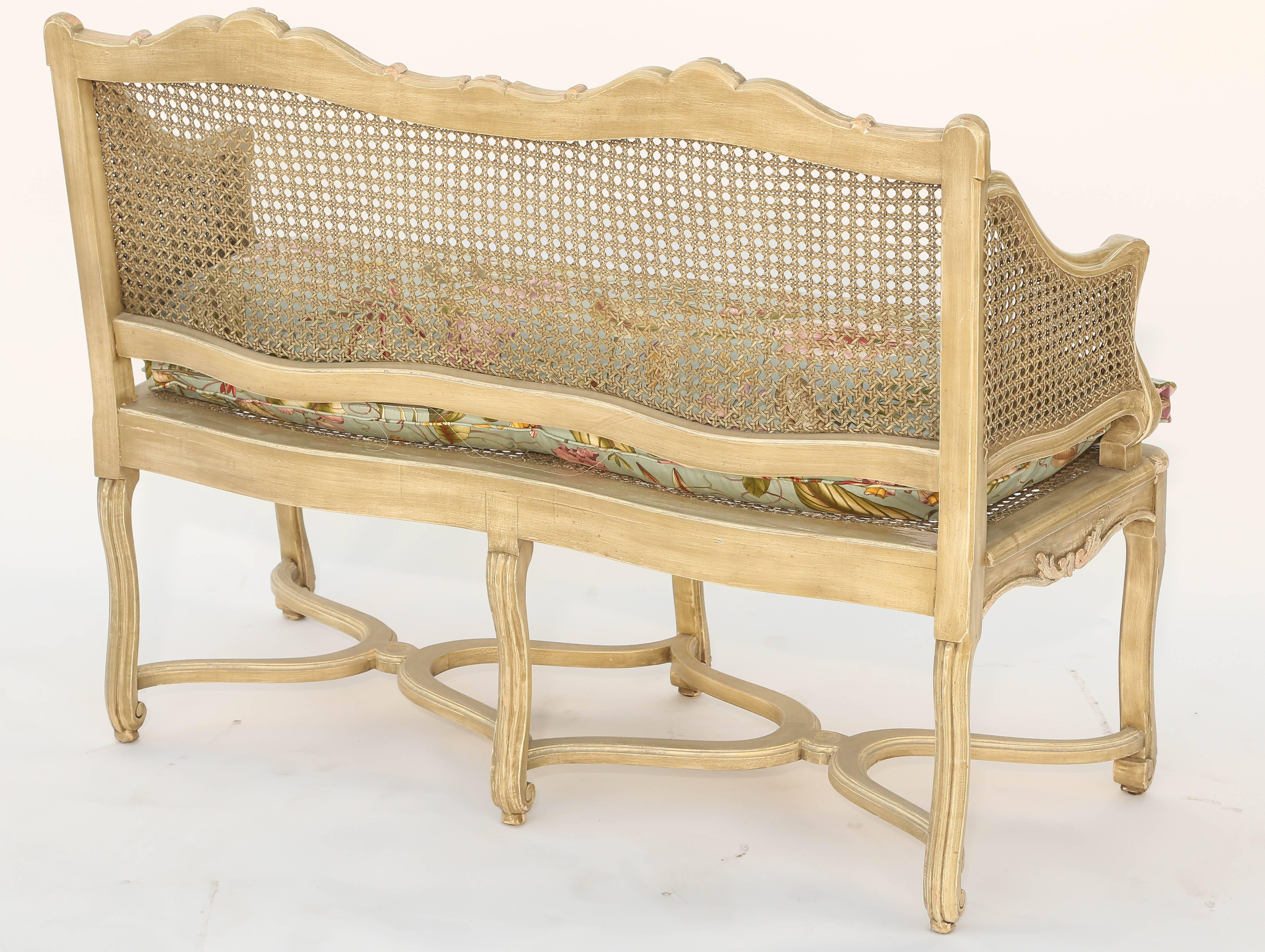 Painted Caned Regence Style Closed Arm Settee In Distressed Condition In West Palm Beach, FL