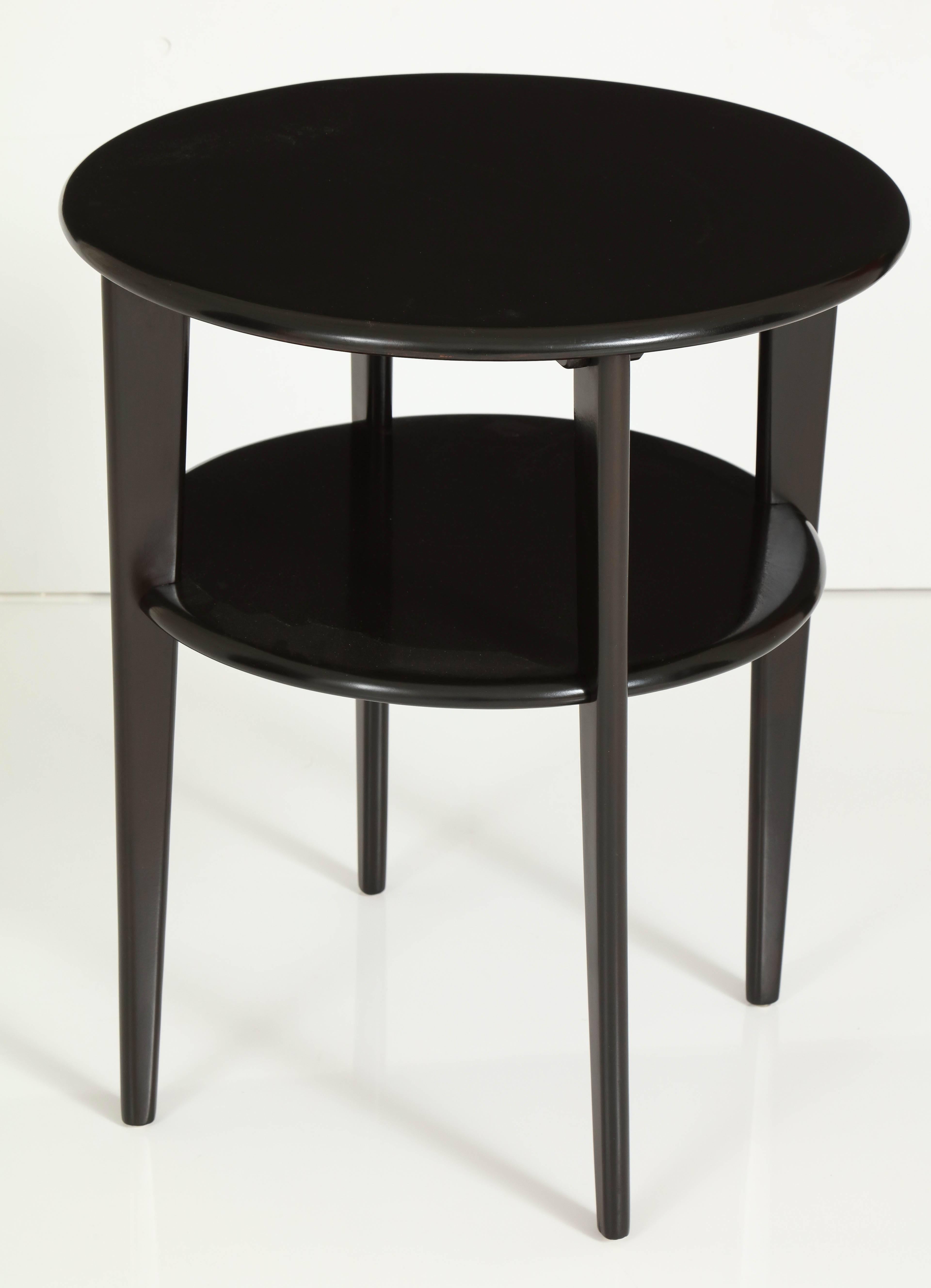 Sable finished maple two-tier round side table in the manner of Russel Wright or Heywood Wakefield, circa 1950.