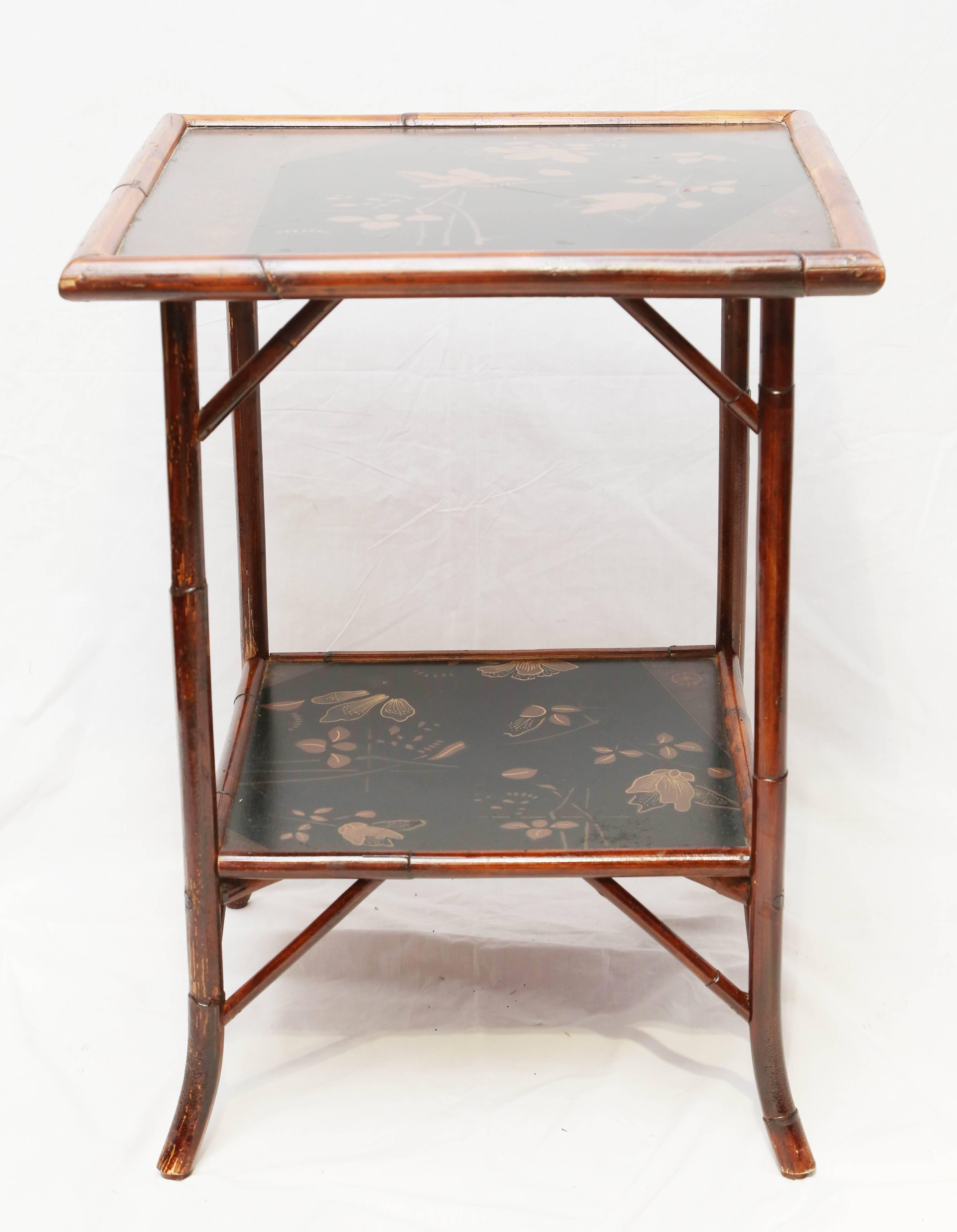 Fine English bamboo two tier side table with Japanning lacquer.