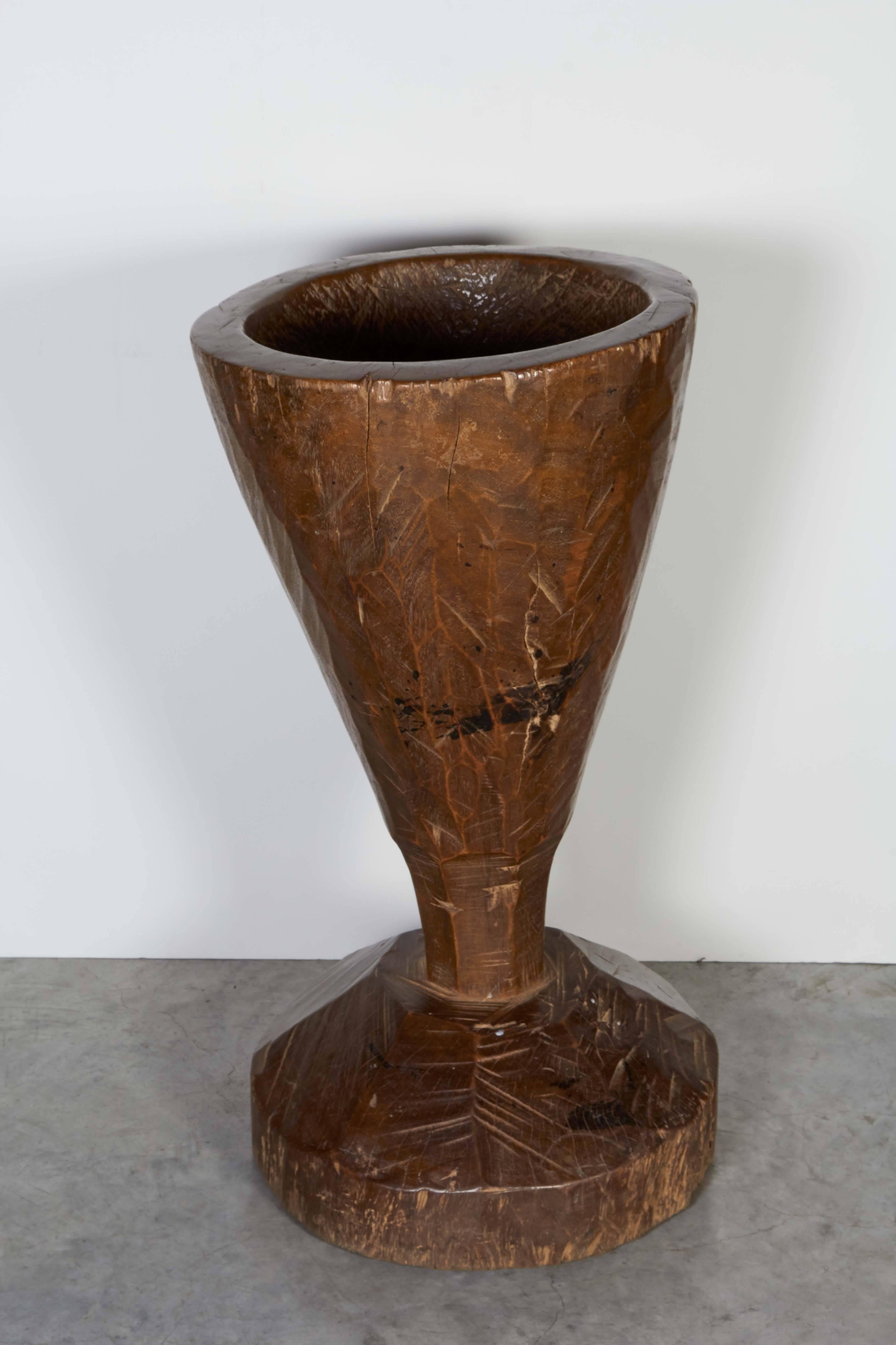 A gracefully shaped tall mortar with beautiful patina, carved out of a single piece of teakwood. From Java, Indonesia, circa 1930s.
M2020.