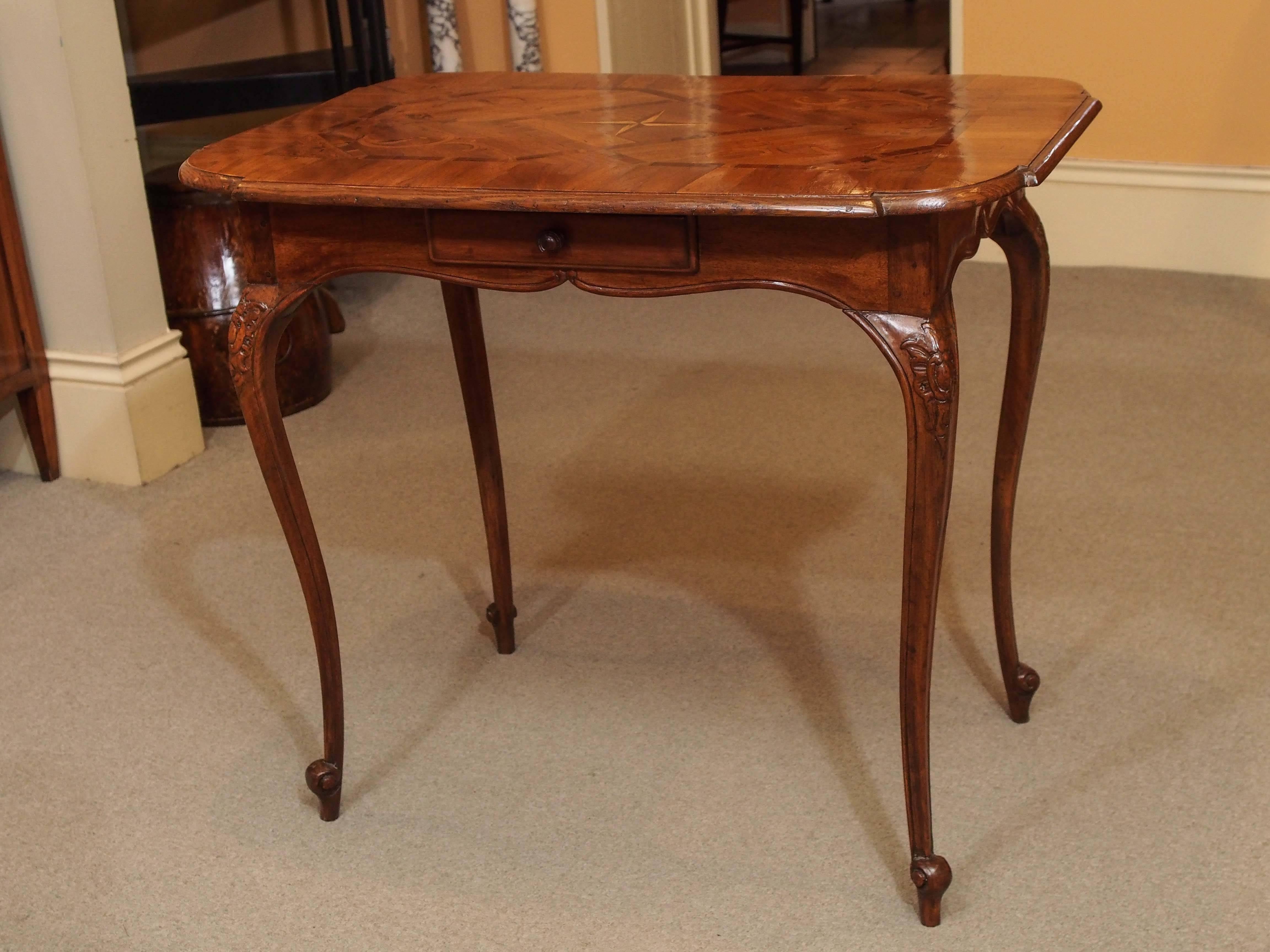 Antique French inlaid tea table. Mahogany and mixed woods.