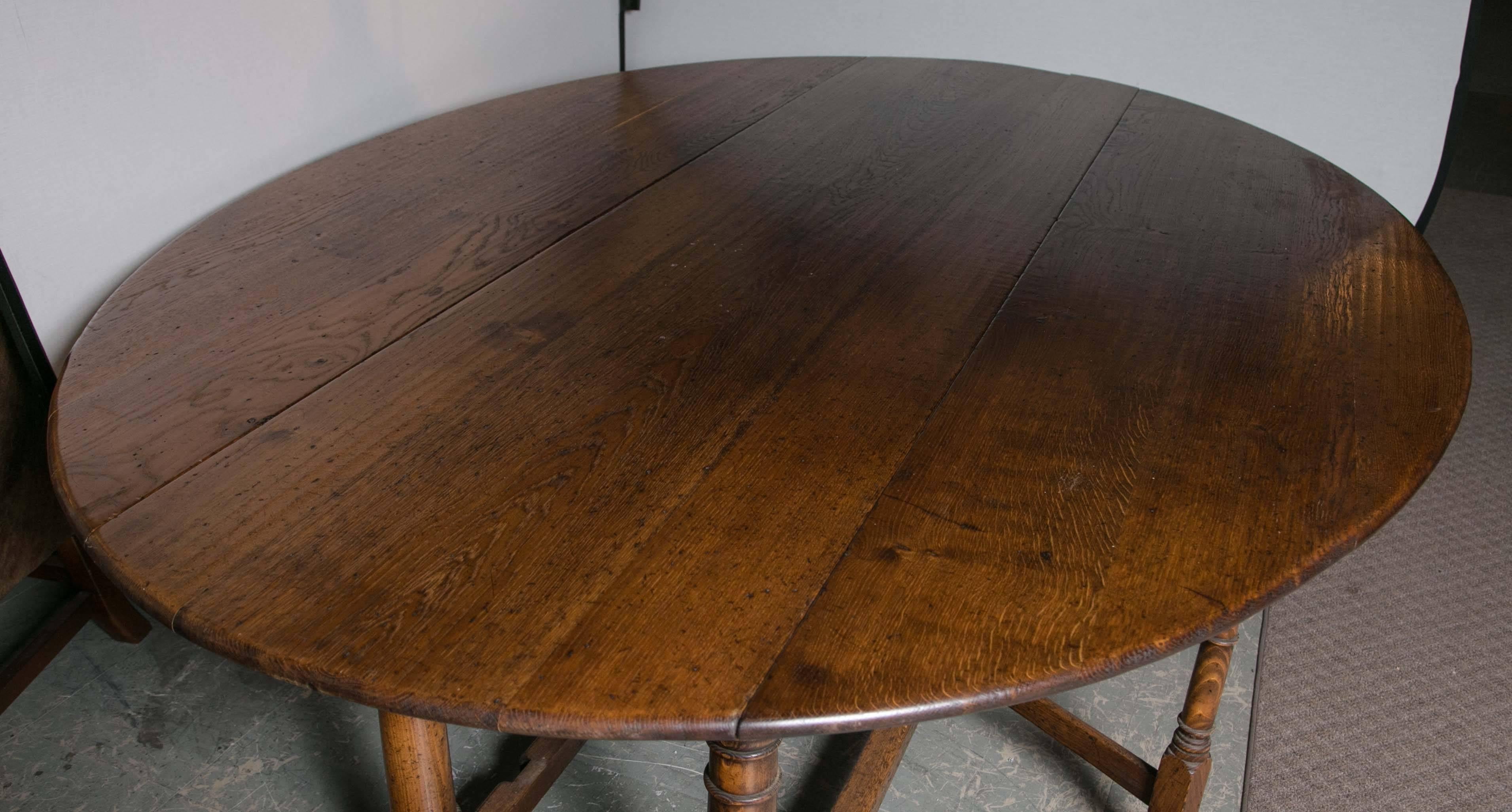 Large English oak gateleg dining table early 20th century.