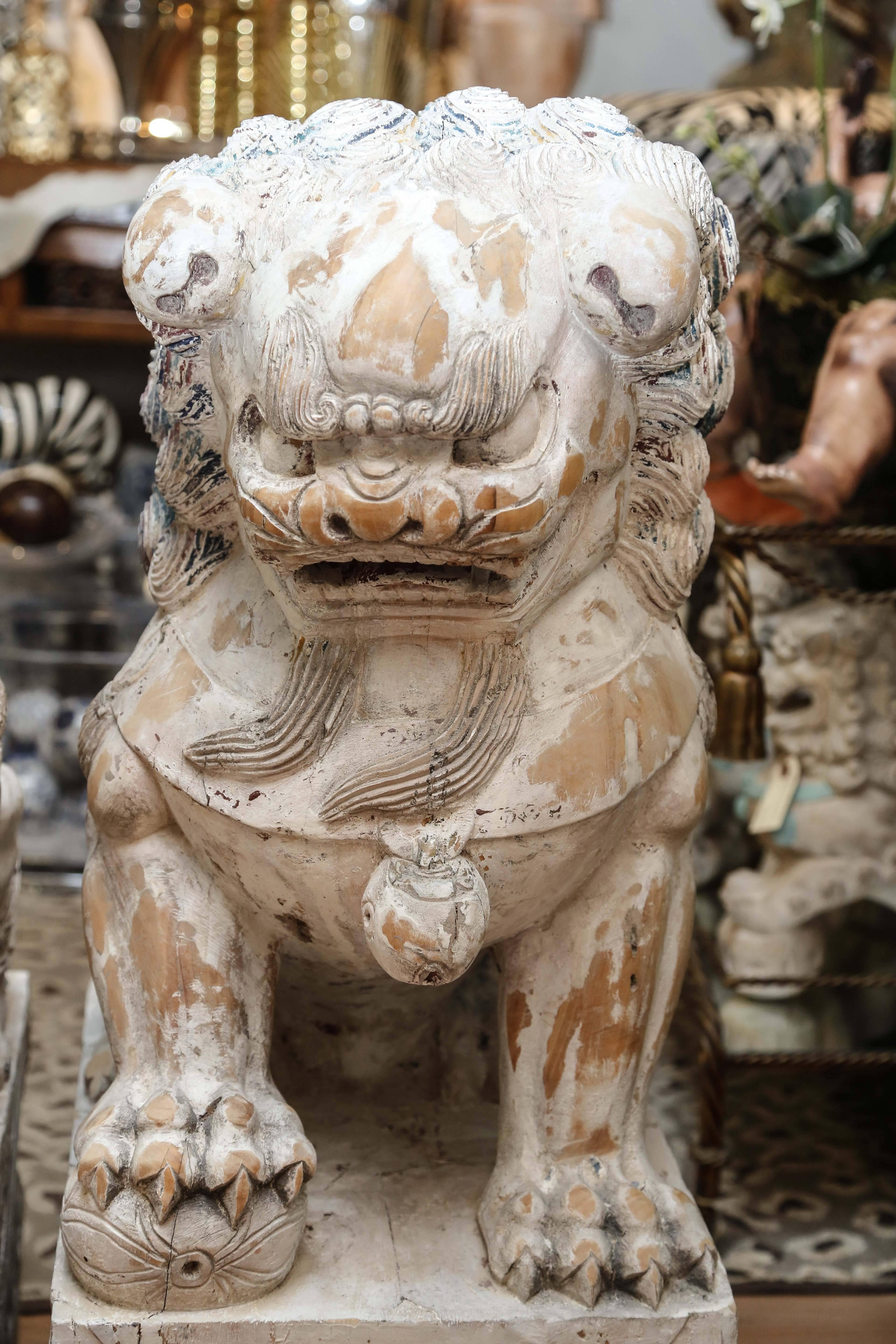 Chinese Pair of Carved Wood Painted Foo Dogs For Sale