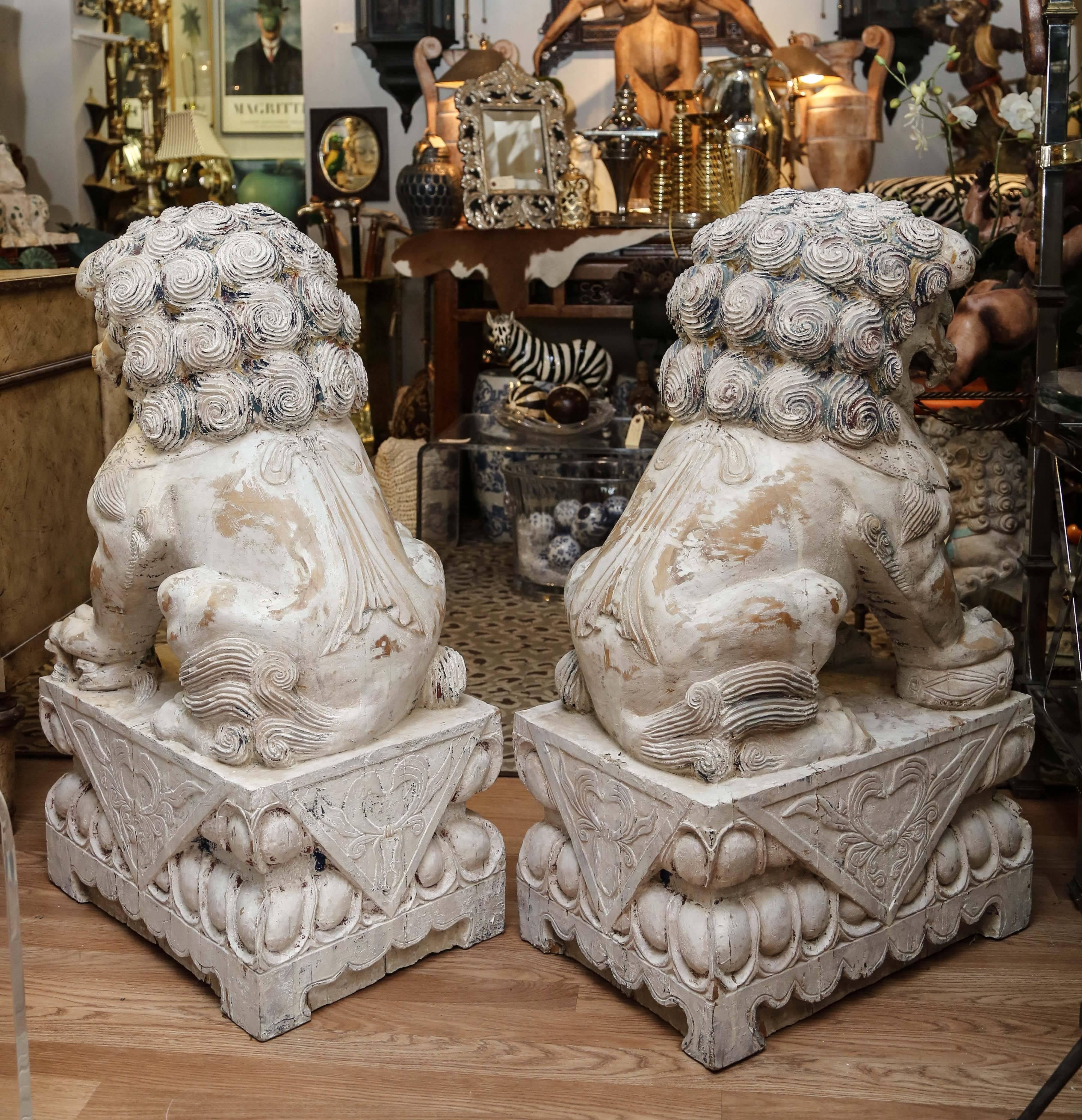Pair of Carved Wood Painted Foo Dogs In Good Condition For Sale In West Palm Beach, FL