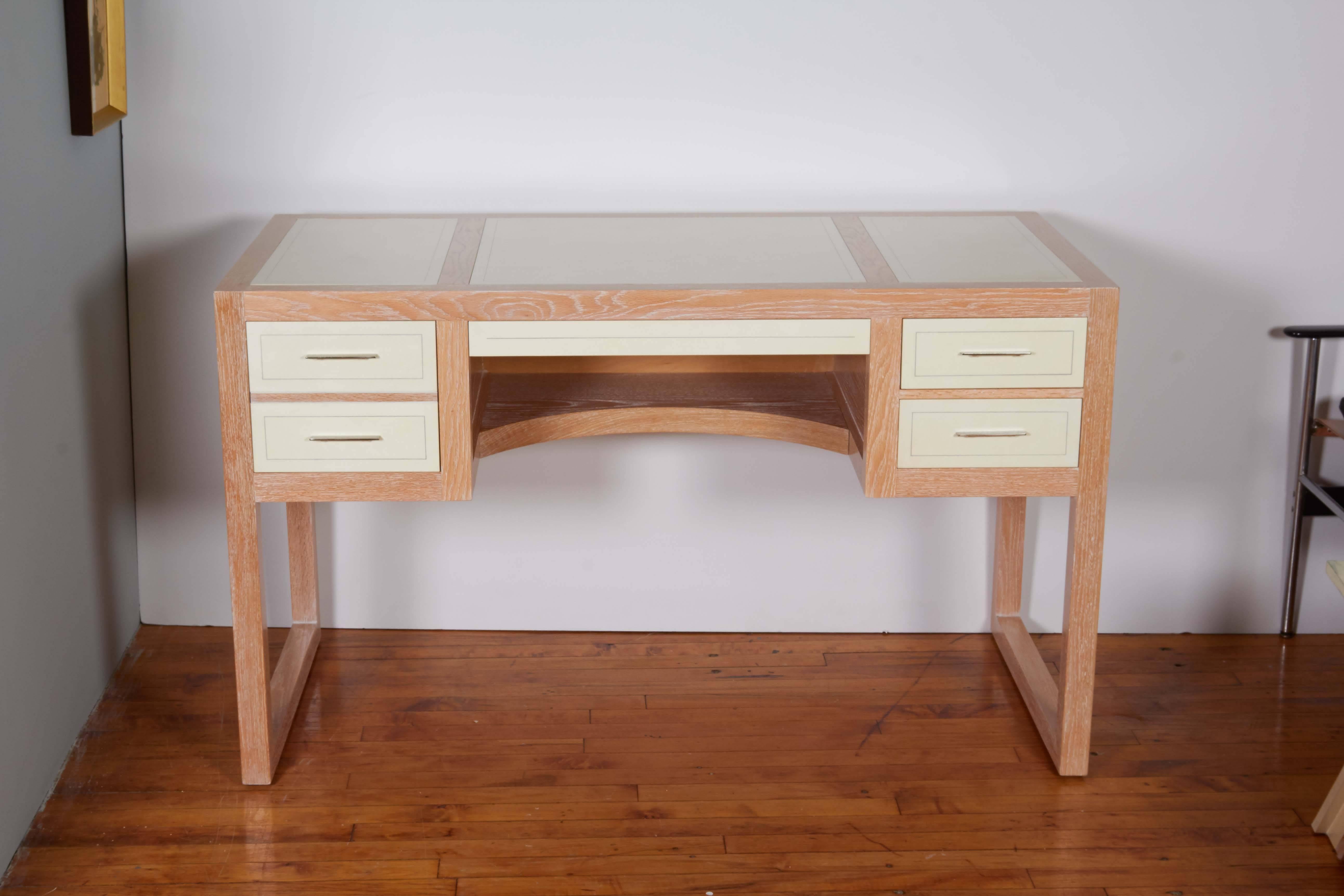 A custom-made contemporary writing desk, produced 2015 by Beni Studio, titled 'Personal Desk'', of the modern rectilinear style, with parchment against oak base, including four side drawers with metal pull handles and long central drawer. Excellent