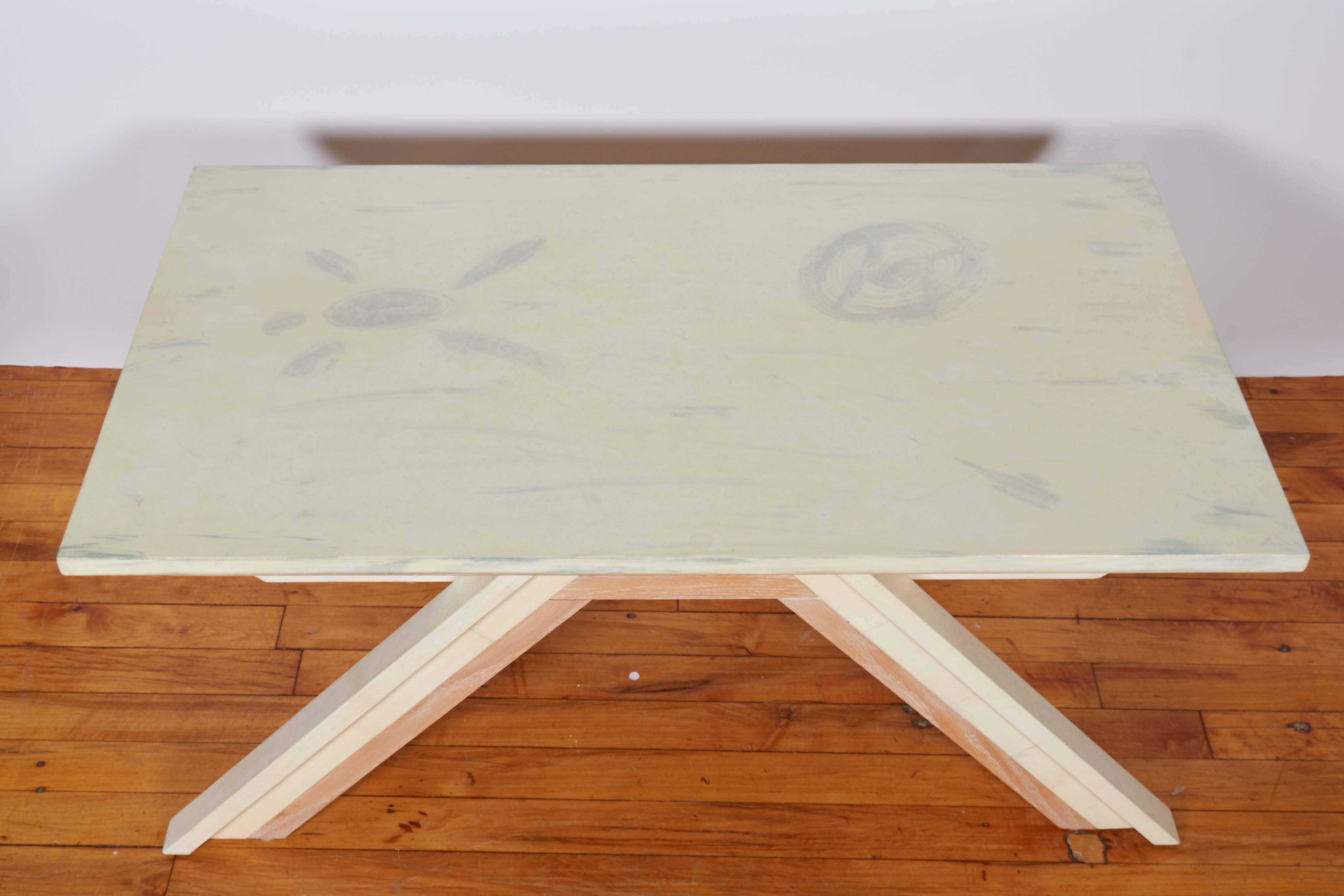 A contemporary coffee table, produced 2012 by Beni Studio, titled 'The Bridge', parchment top with artful abstract designs, raised on painted oakwood base with slanted legs. Excellent condition.

10826