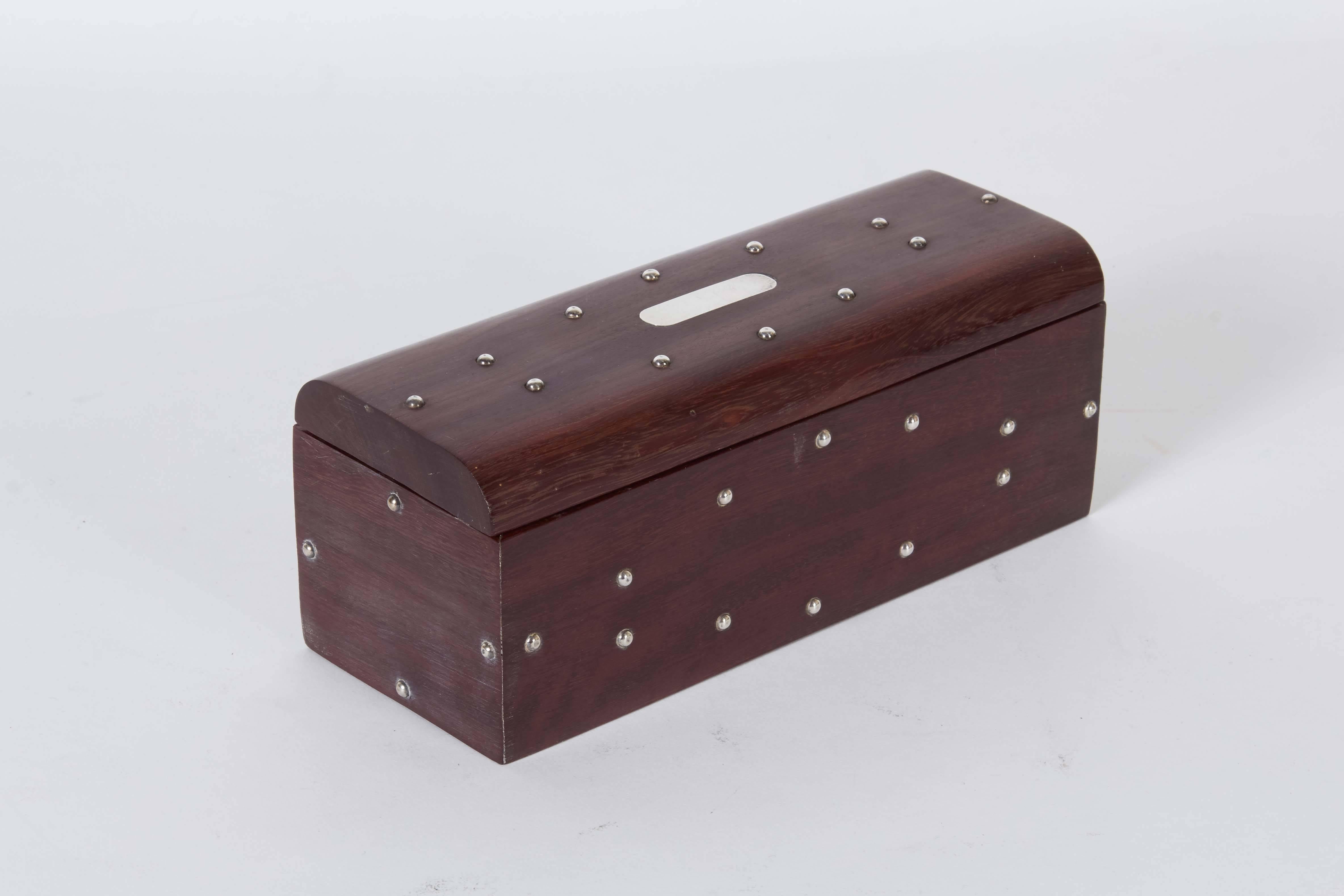 A circa 1970s Mexican Dominoes set, pieces and matching box crafted of rosewood, accented with sterling silver. Very good vintage condition, consistent with age and use.

10790