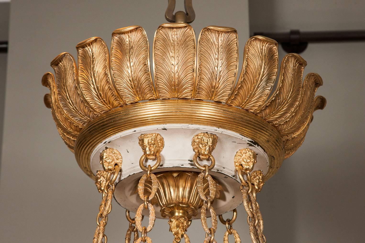 A spectacular bronze and painted tole chandelier, circa 1840-1850.