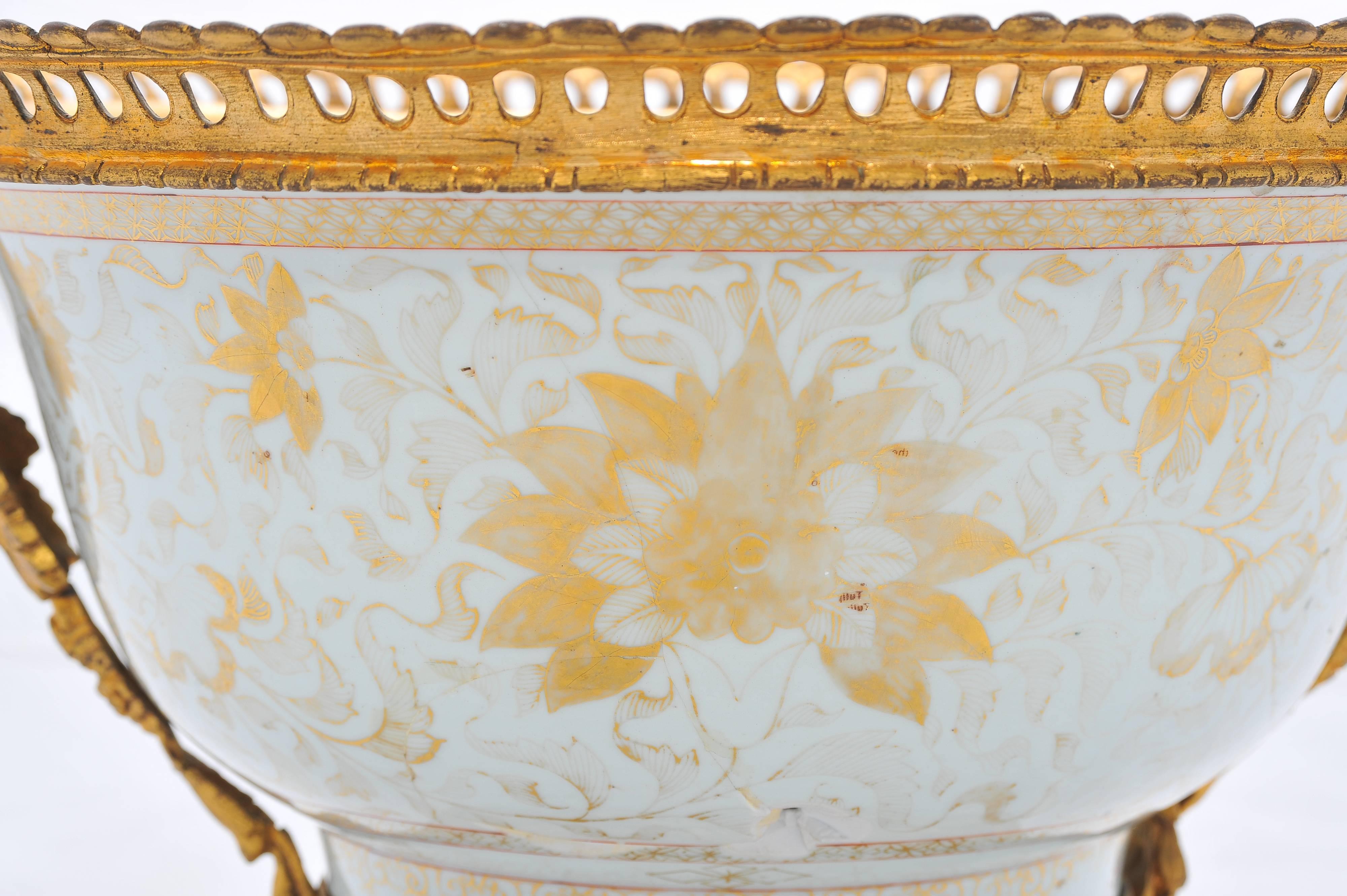 A very impressive 18th century Chinese export porcelain bowl, having gilded floral decoration, wonderful gilded ormolu handles and base with scrolling foliate detail.