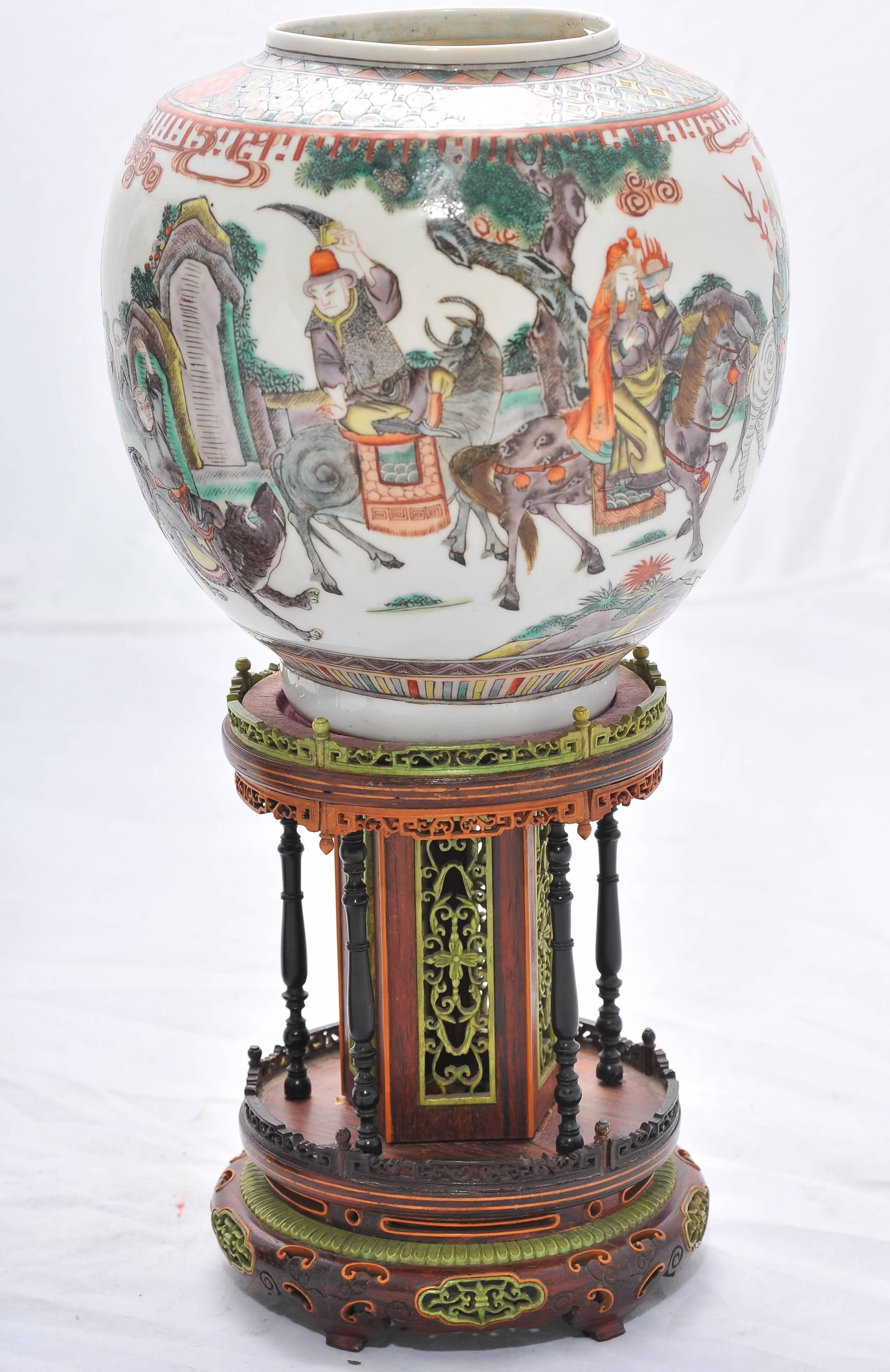 A very good quality pair of Chinese 19th century Famille Verte porcelain lanterns. Having classical painted scenes with panels of actors in combat astride various beasts, divided by birds and flowering branches. 
Each mounted on two tier inlaid
