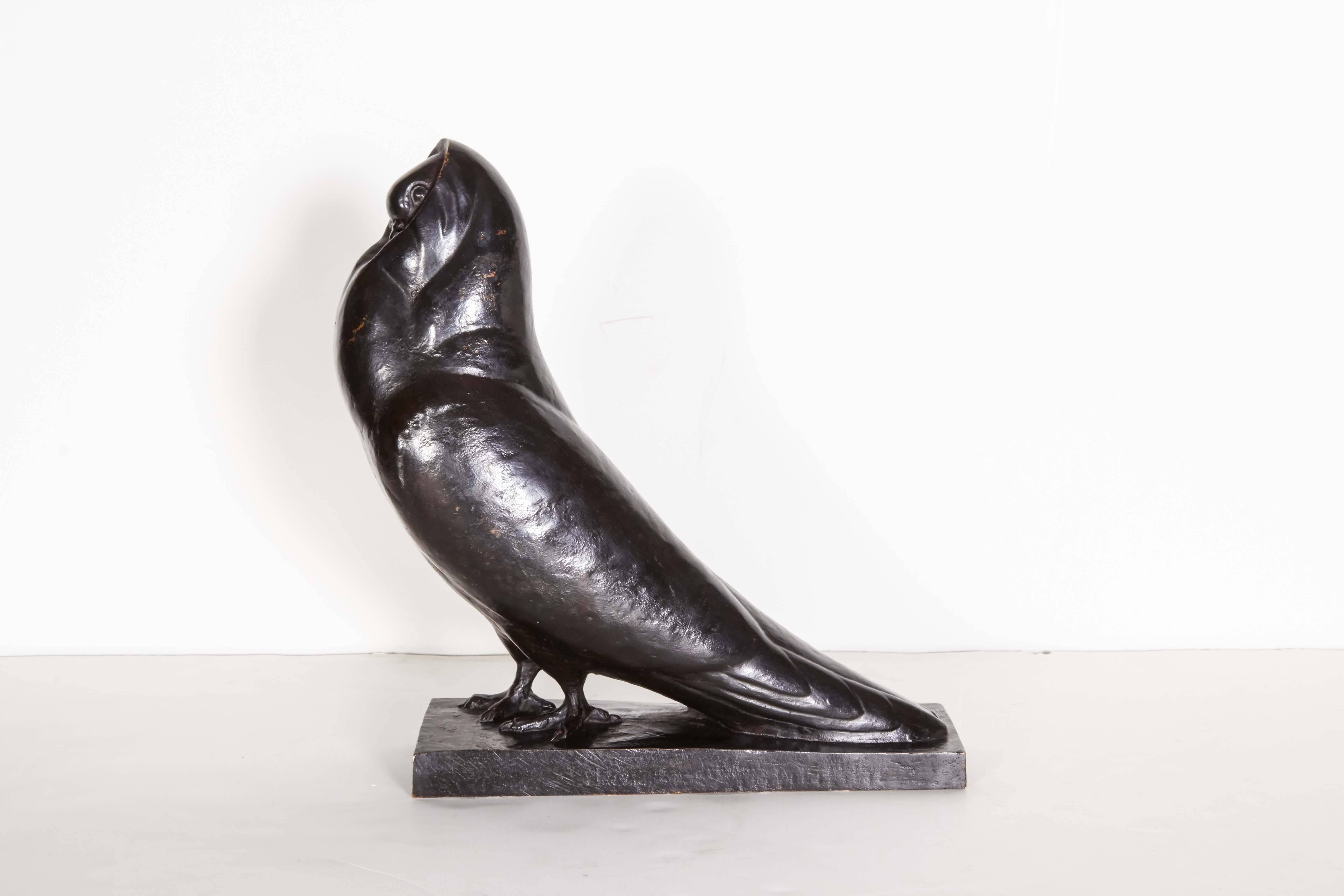 Highly stylized French modernist sculpture of a dove with elongated tail and rounded hood. Signed S. Boutarel .
 Born in Paris at the beginning of the 20th century, Simone Boutarel exhibited in the Paris salons from 1925 on. She won a silver medal