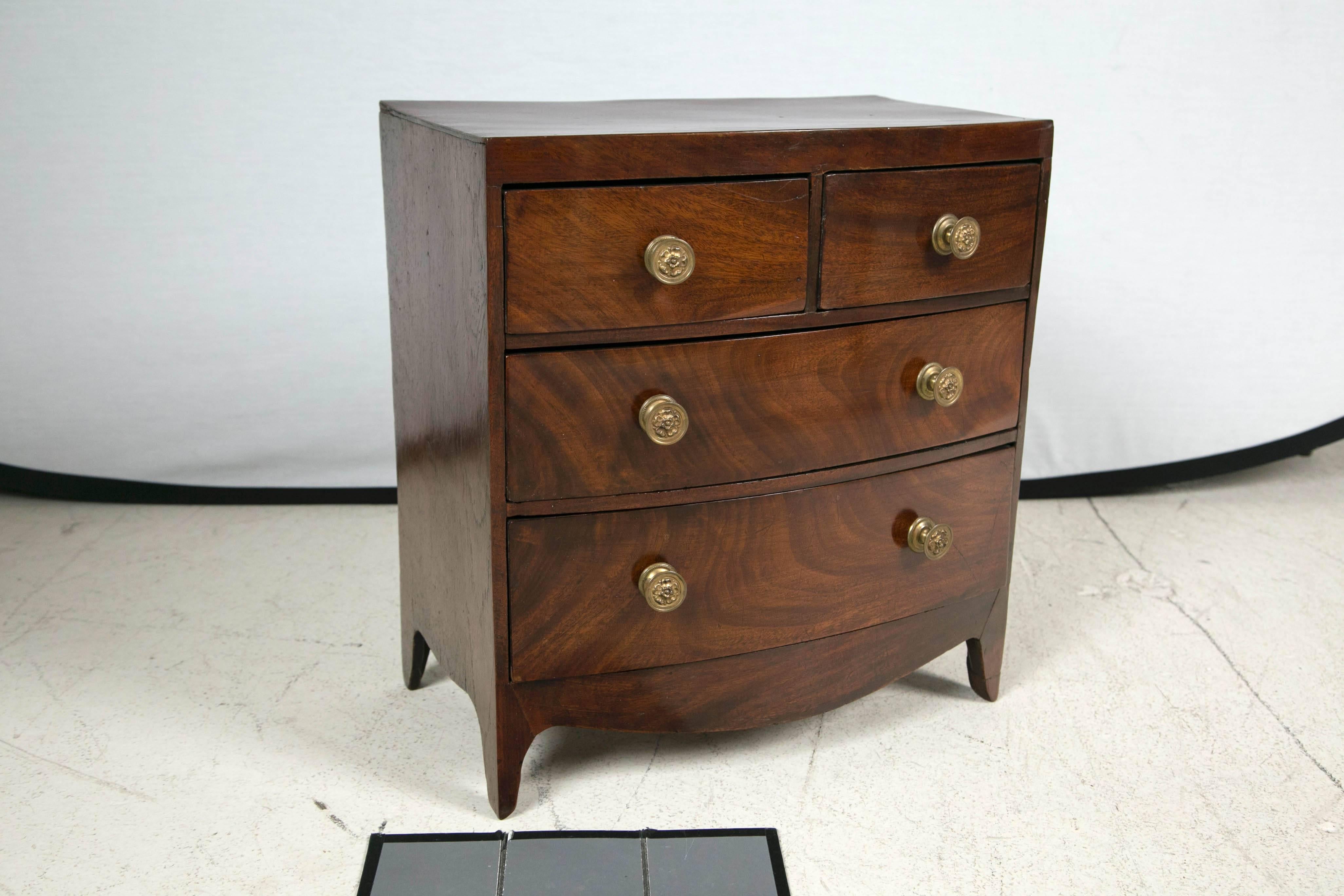18th century English Mahogany four-drawer diminutive chest with four drawers 
and brass knobs. 

Very small piece.