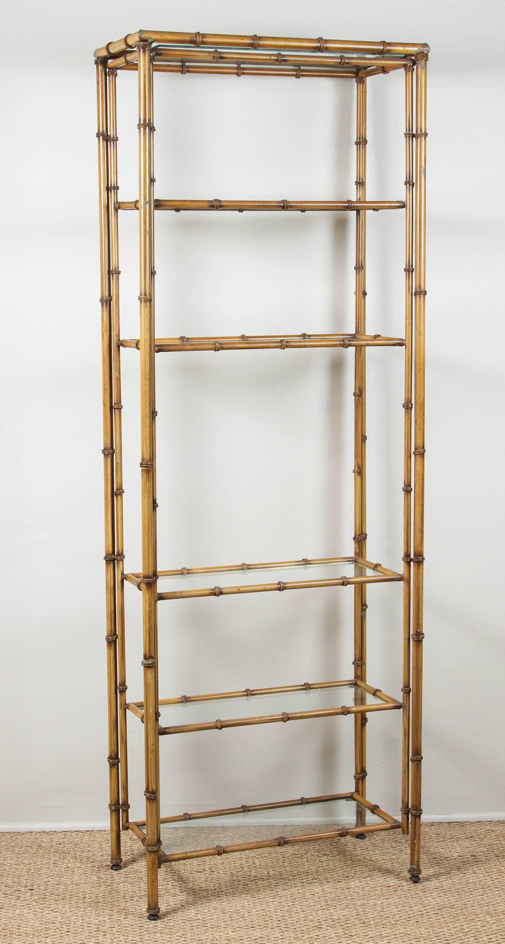 Vintage painted metal faux bamboo etagere with glass shelves.