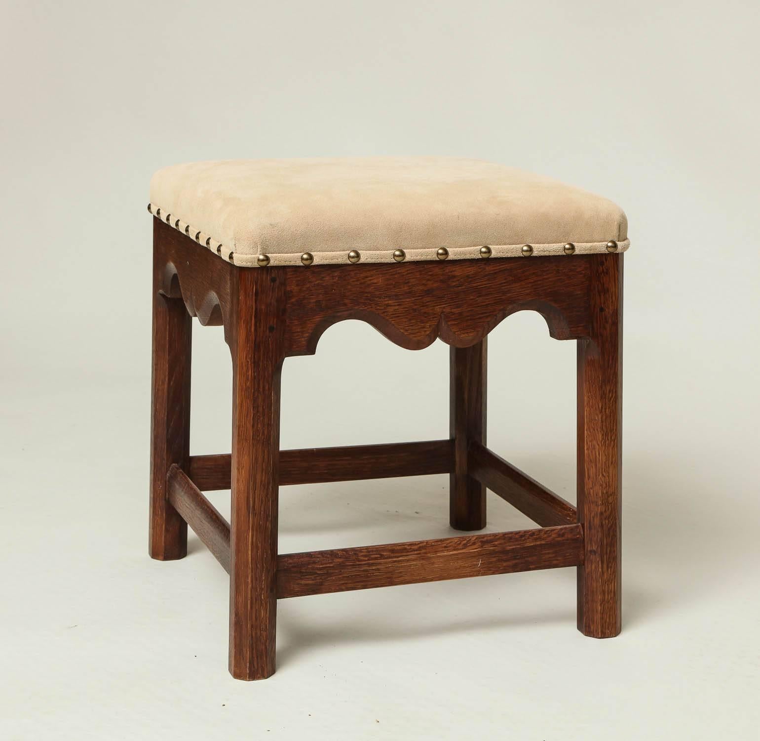 The Russell stool, a handcrafted recreation of one of Gordon Russell's earliest and most successful Cotswold School designs, crafted in white oak by Wooster and Essex having an upholstered seat over chamfered legs and stretchers, the aprons with