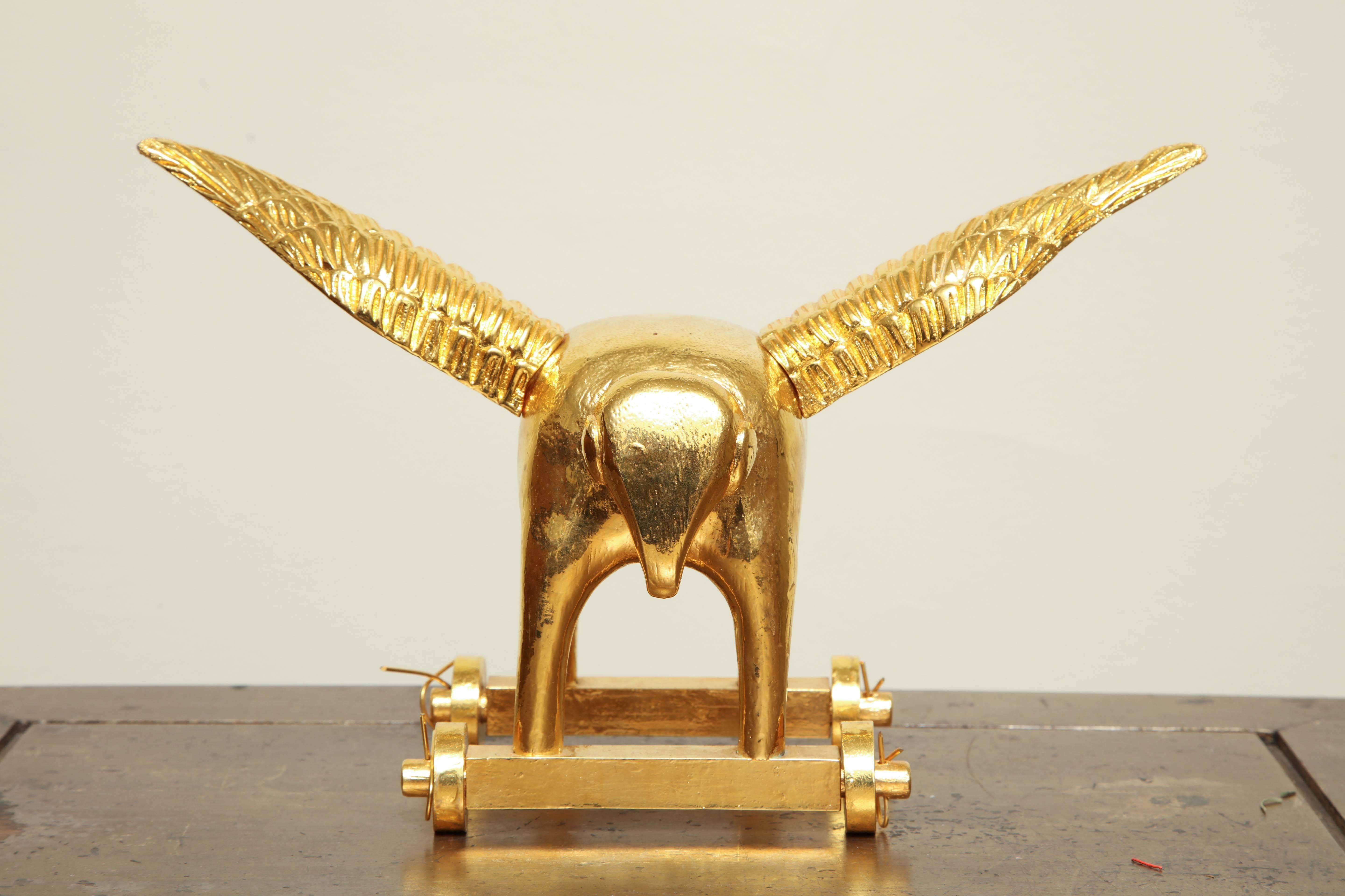 Hand-carved elephant plated in 24-karat gold, with removable magnetic wings by American artist Matt Austin.