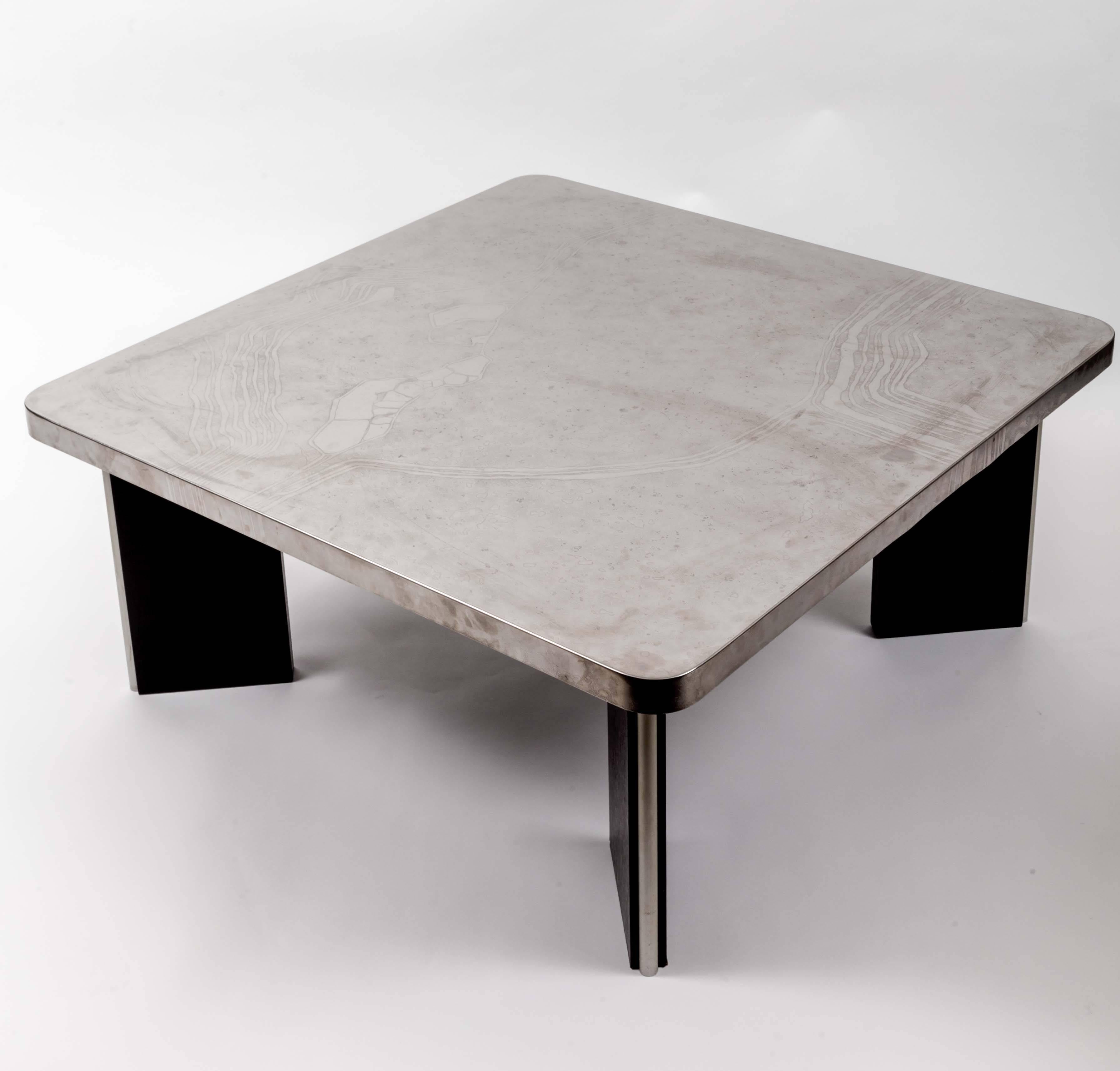 Wooden base with aluminium top.