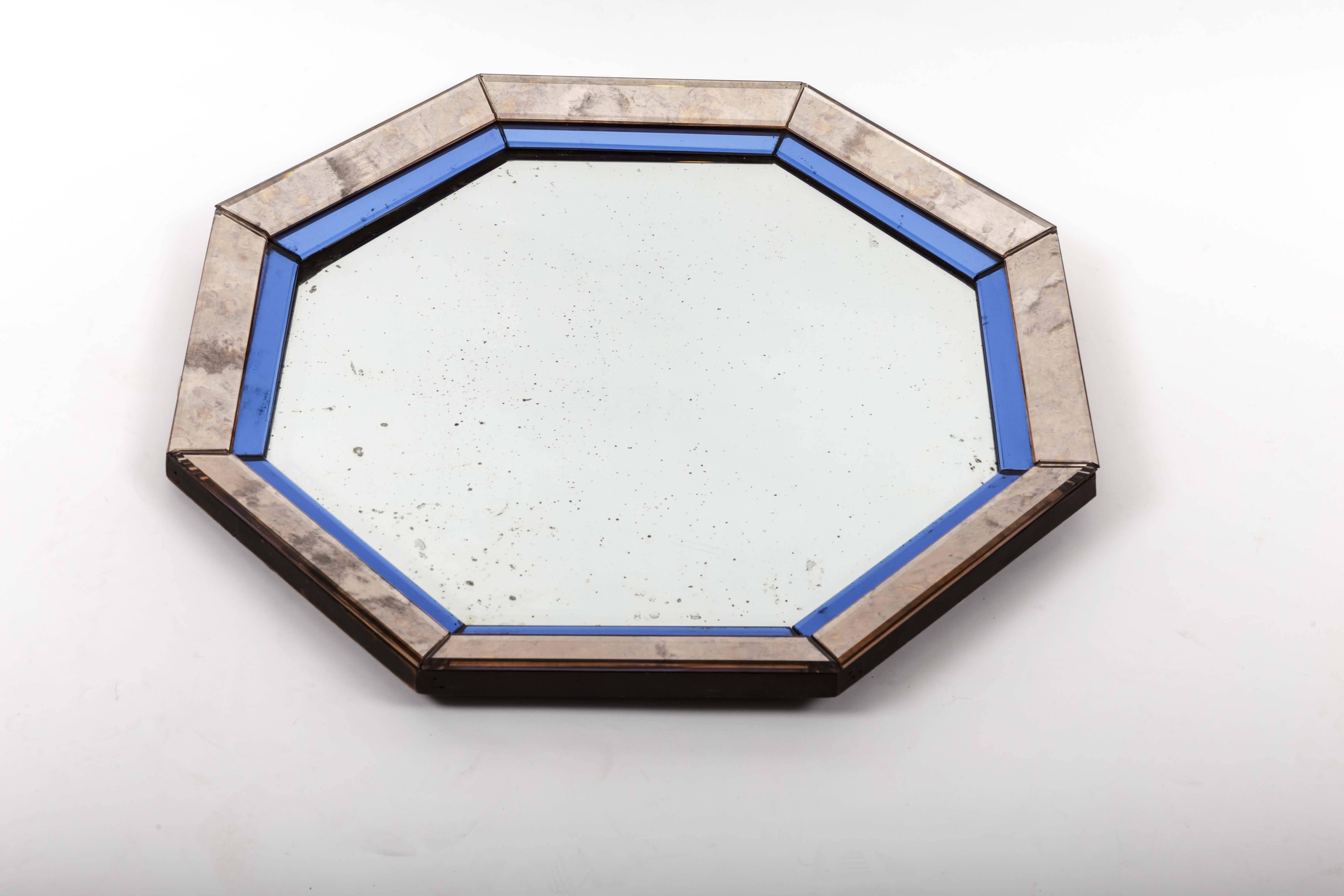 Mirror in an octagonal shape with blue and antiqued silver frame.