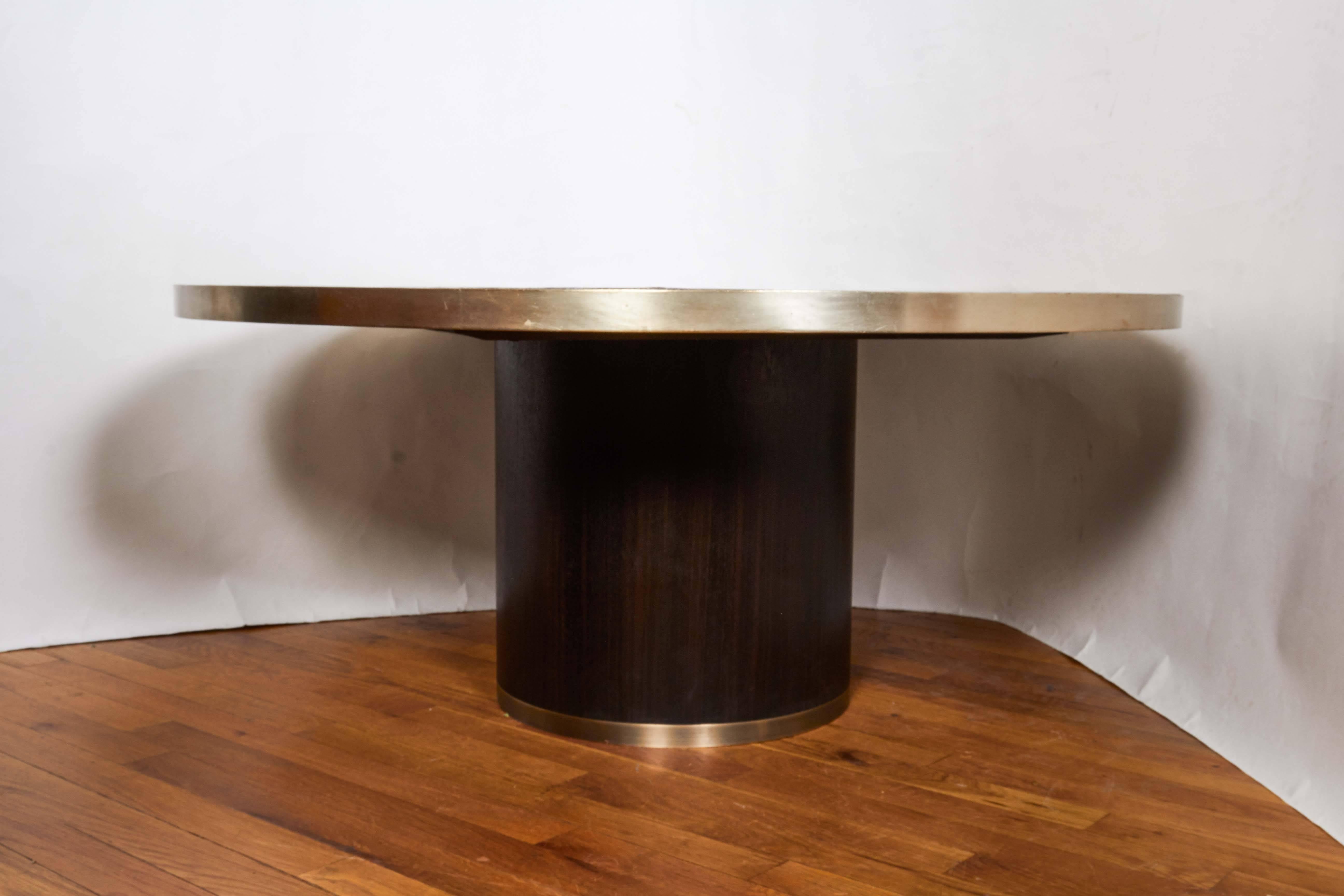 A Mid-Century Modern mosaic tile and bronze coffee table, black cylindrical base.