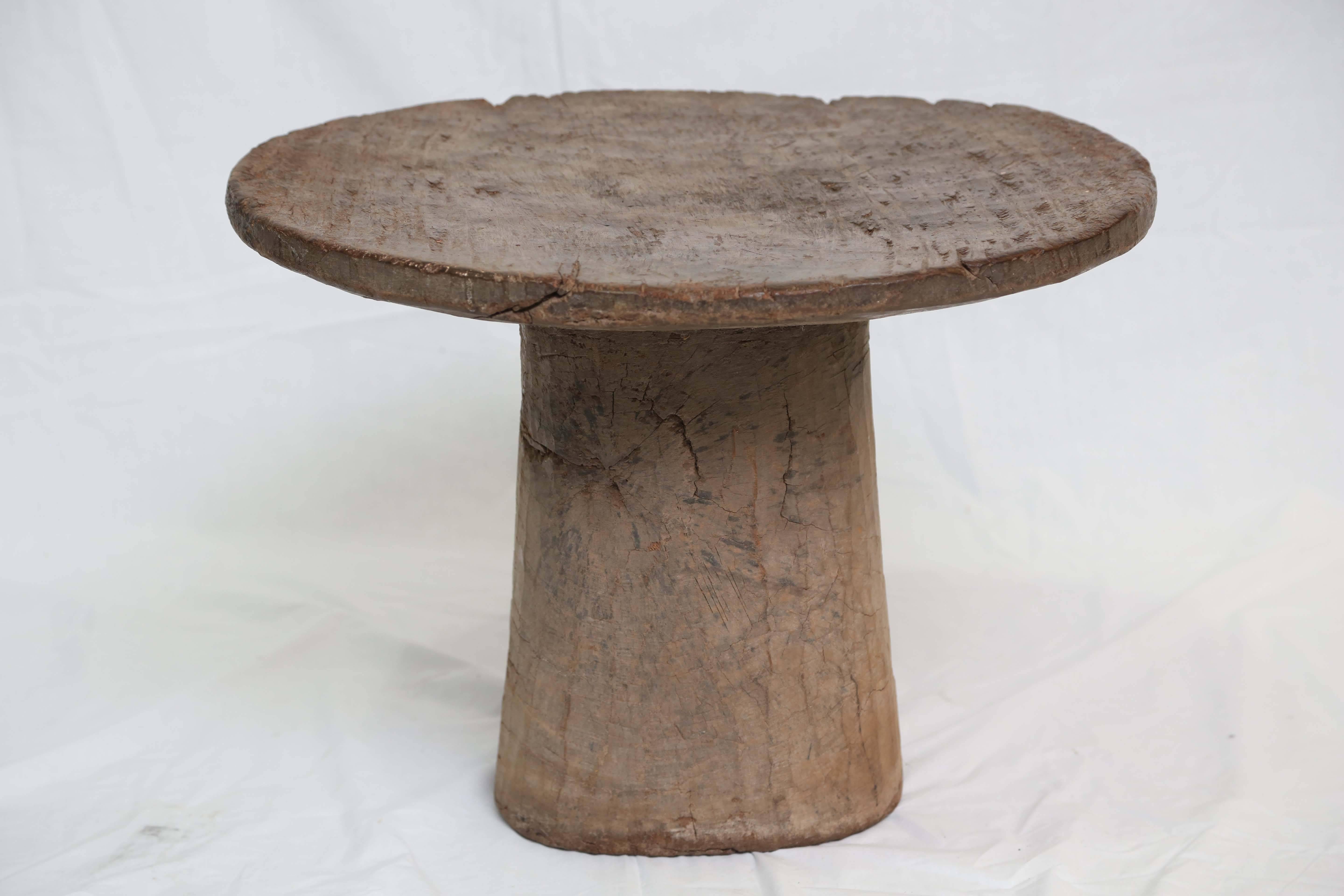 This is a stunning African ceremonial treasure, very much used with great patina, very heavy, carved from a solid tree trunk of an African tree, it makes a strong contemporary effect. It can be used with contemporary interiors, with its great