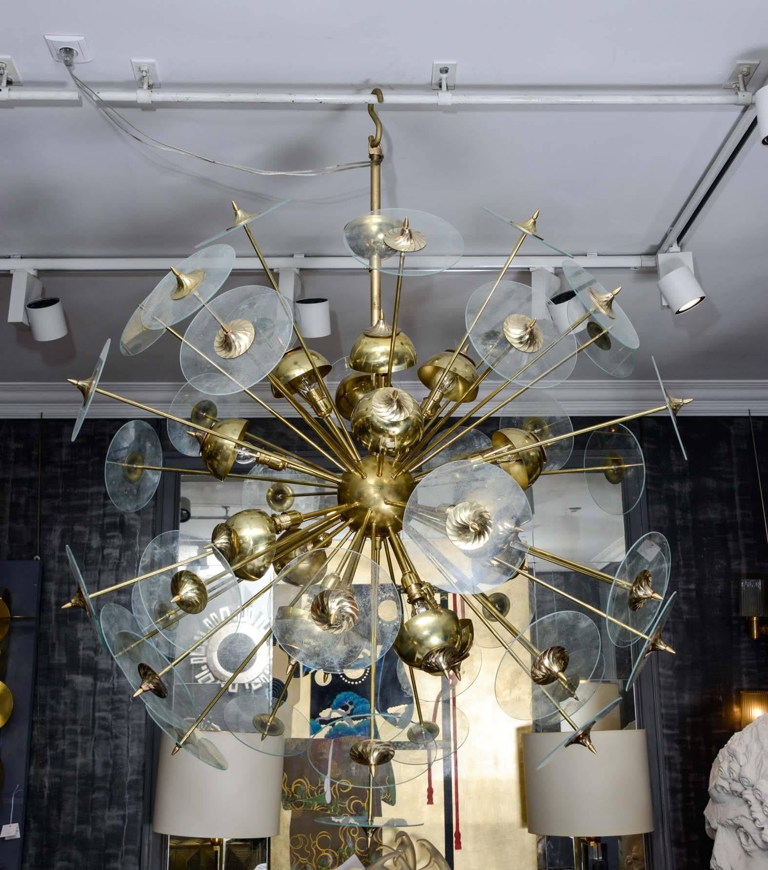 Sputnik chandelier in brass and vintage glass disks, fifteen lights.