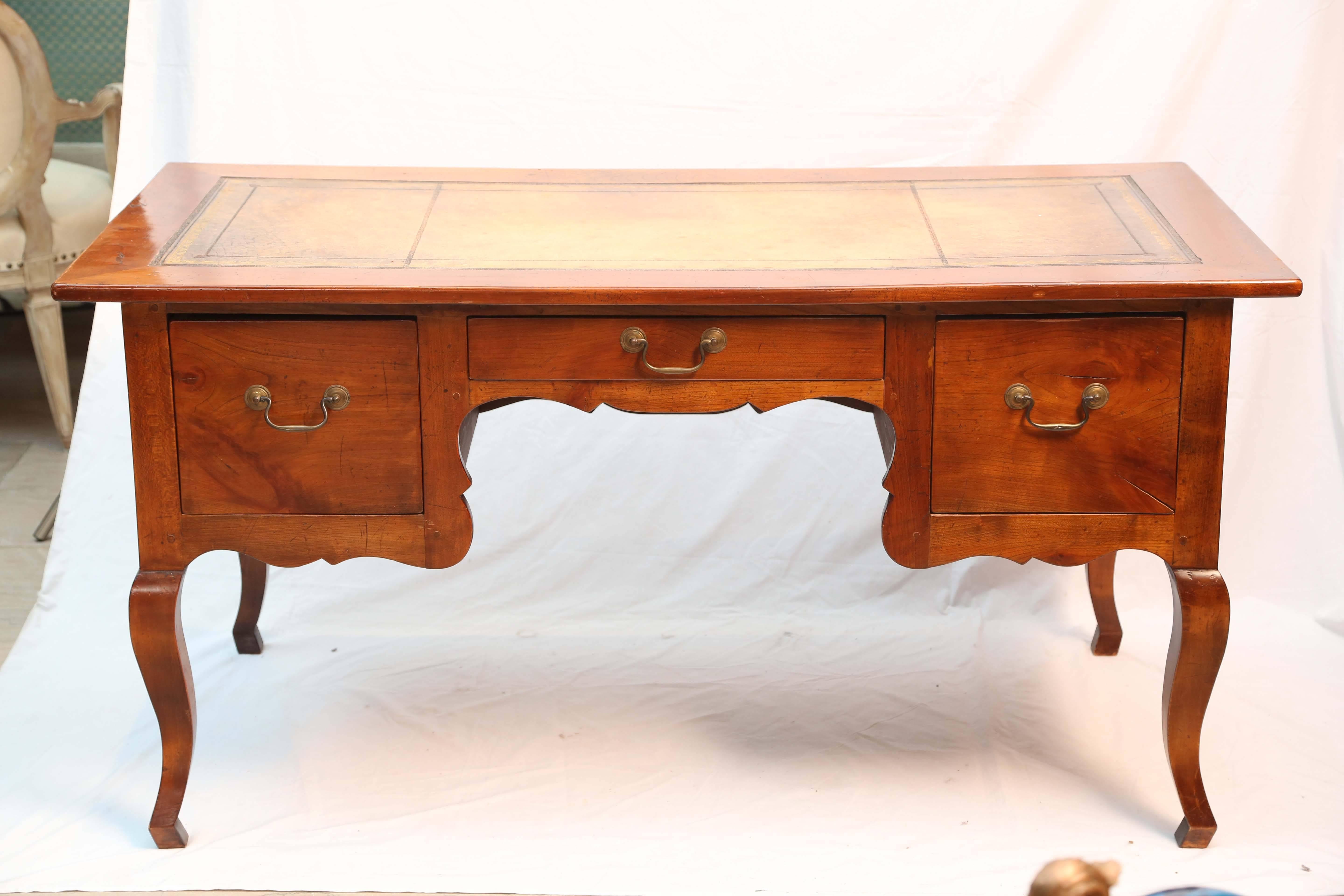 Rich patina and wonderful scale - graceful and unusual design. The desk is fitted with deep drawers and embossed leather top. Sides and back are paneled.