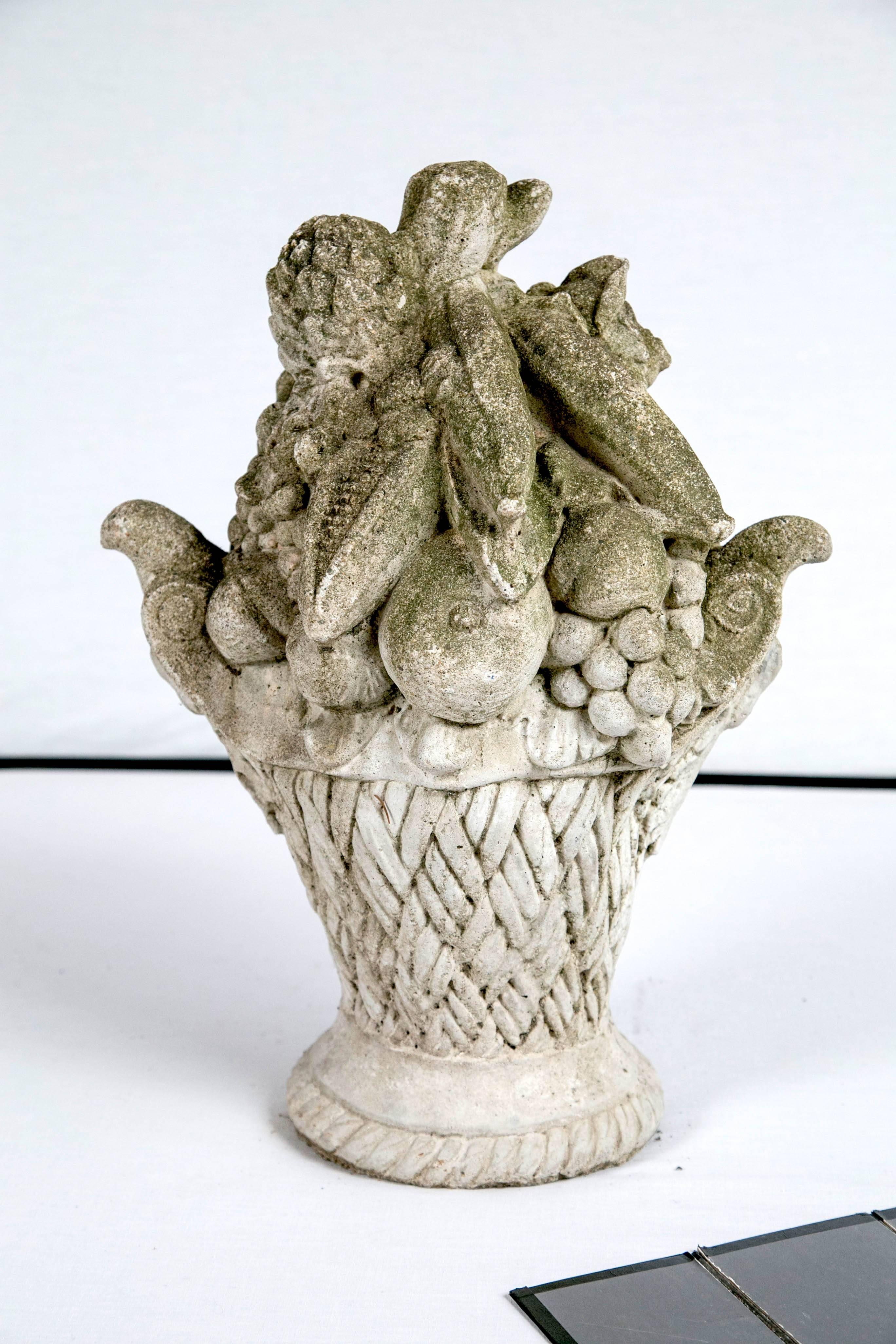 Cast stone garden ornament, basket of fruit, circa 1920. Wonderfully detailed with aged patina. A perfect addition to the garden or as indoor decoration.