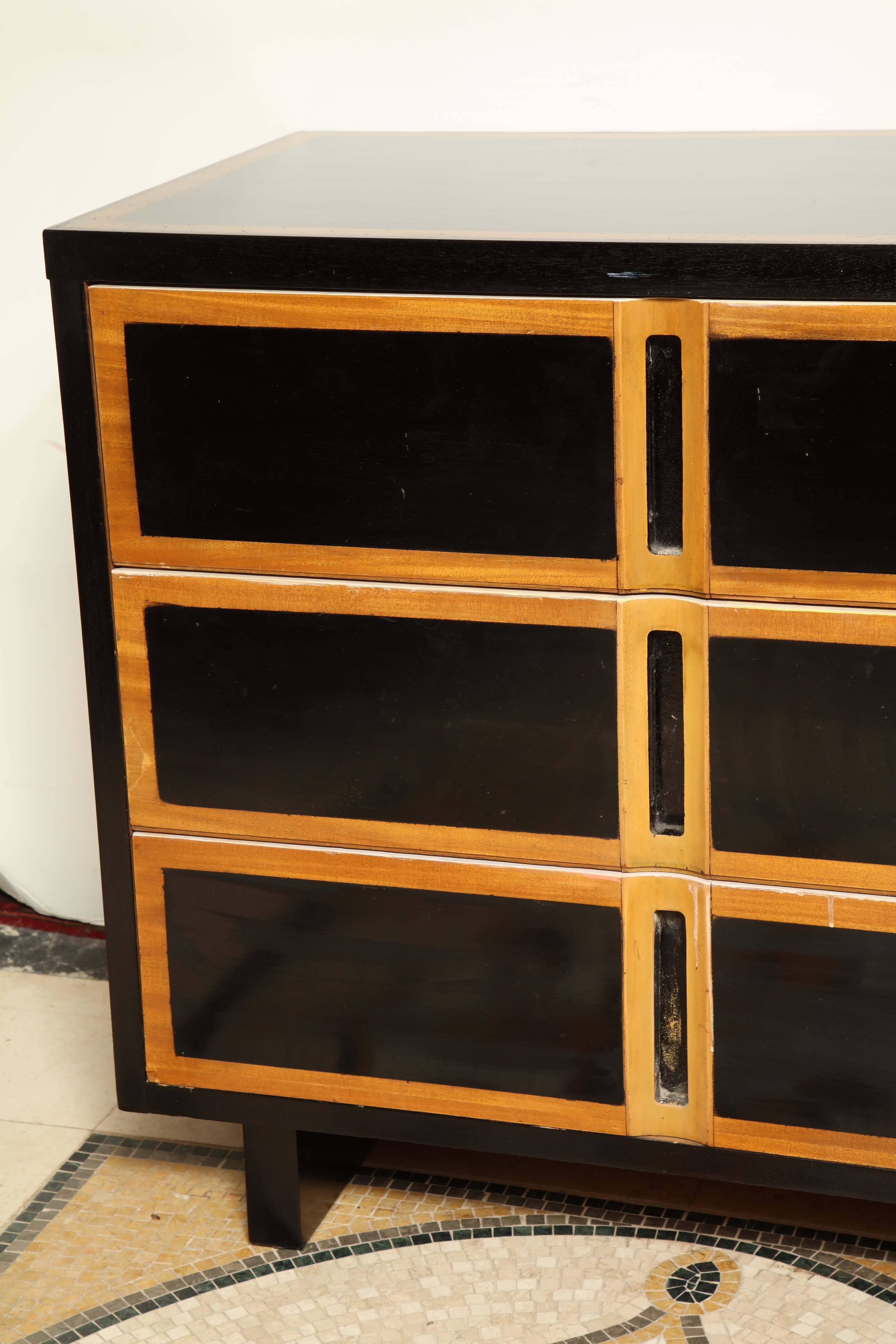 Pair of Mid-Century three-drawer ebonized commodes.