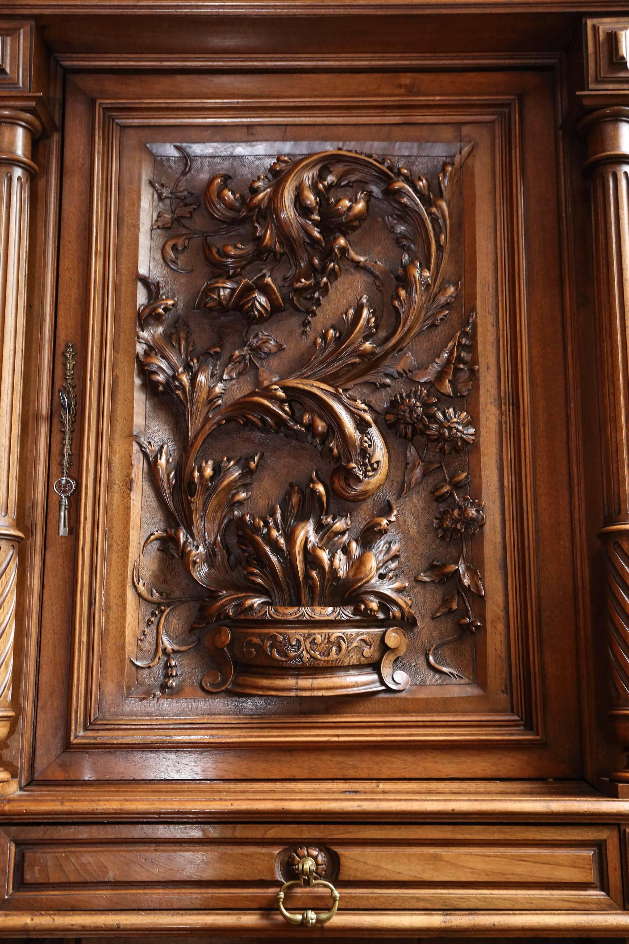 Henry II buffet that is large and impressive; original finish with great carving!
Made of walnut. Pegs together for assembly and shipping. The Carving  is deep and detailed and has
Beautiful flourishes of flowers and leaves. It has display space and