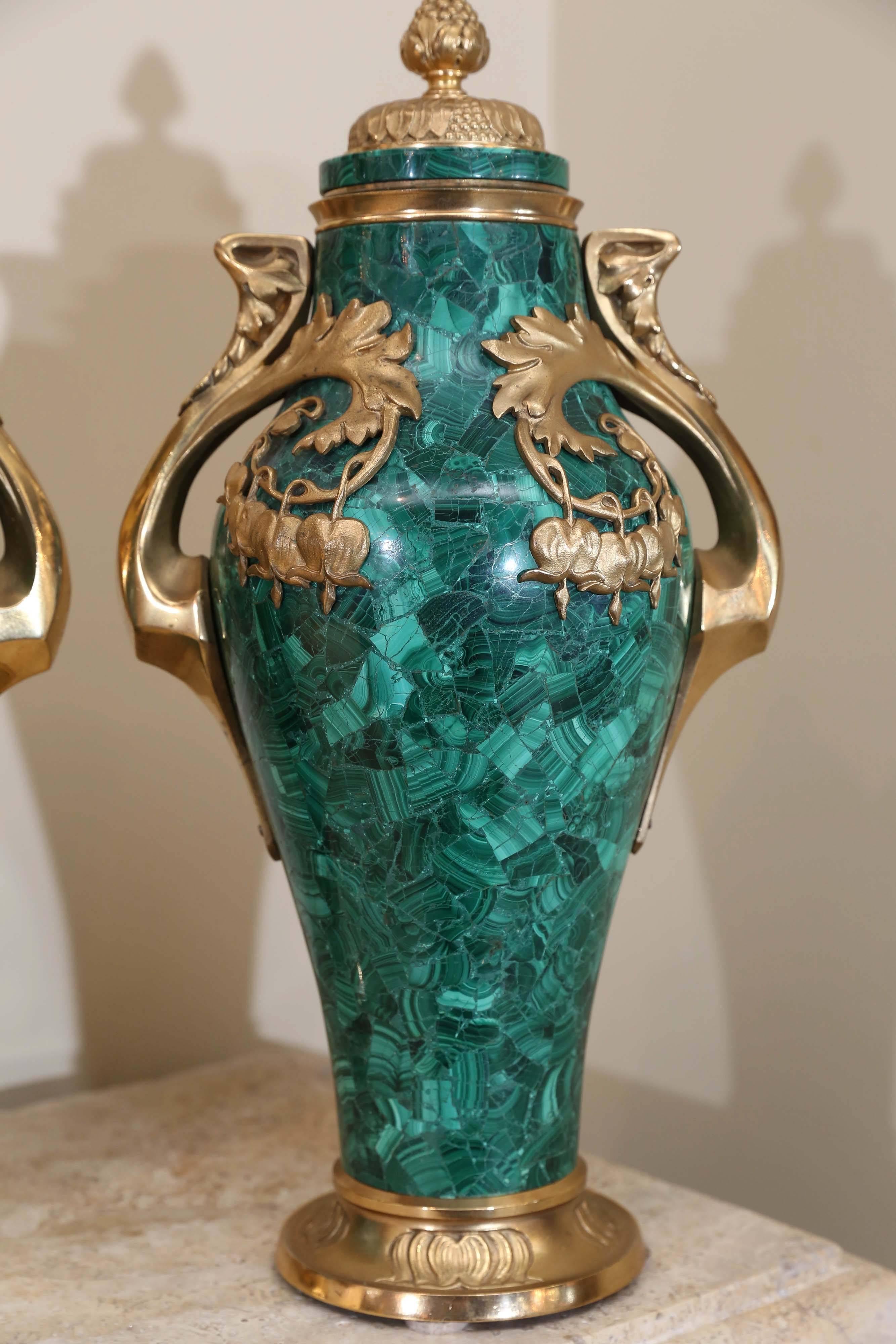 Superb pair of Russian malachite capped urns in the Nouveau style
with bronze doré mounts.