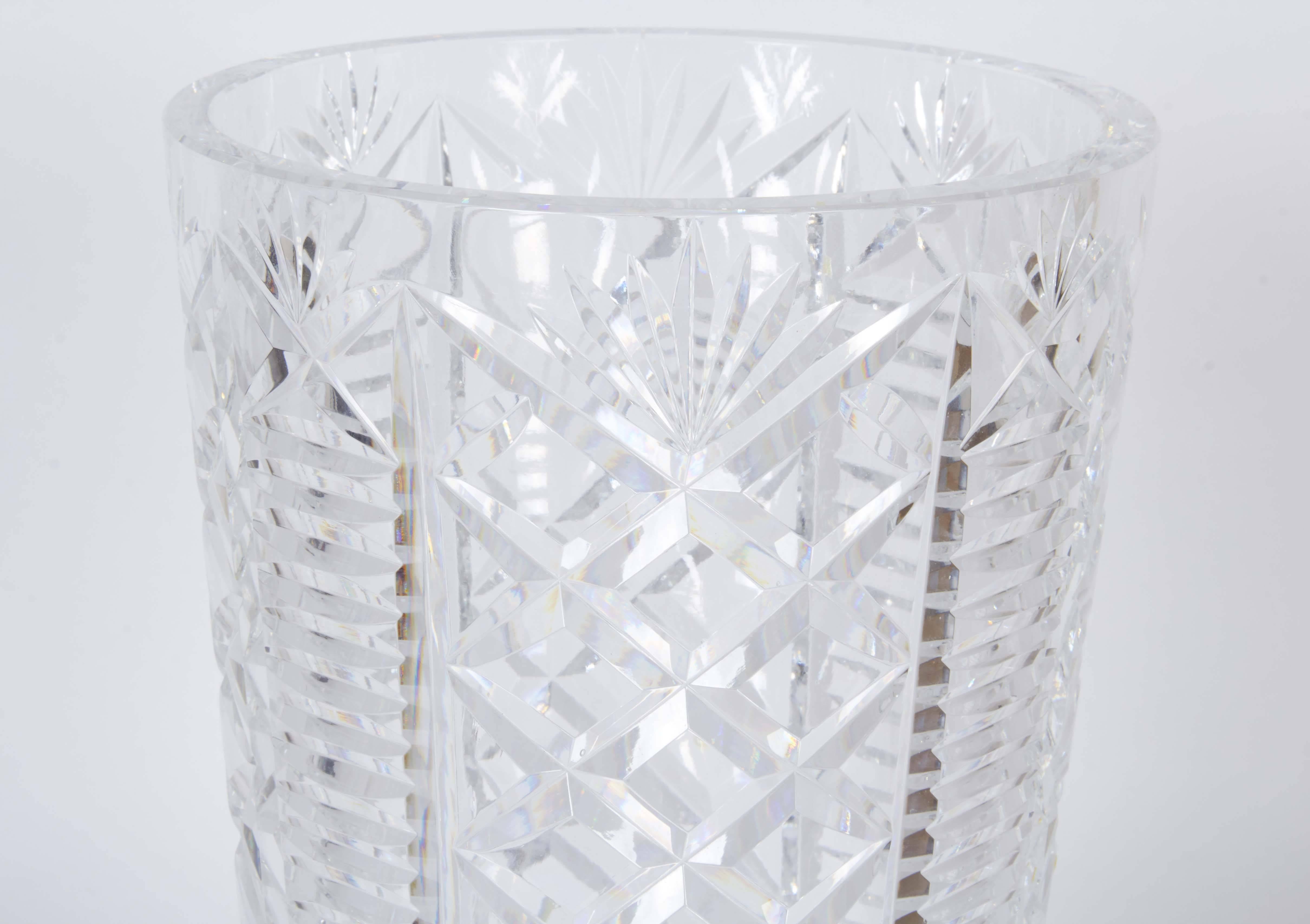 A cut crystal 'Clare' pattern vase, produced circa 1970s by Waterford, of tapered cylindrical form. Very good vintage condition, with minuscule chips to base.

10937