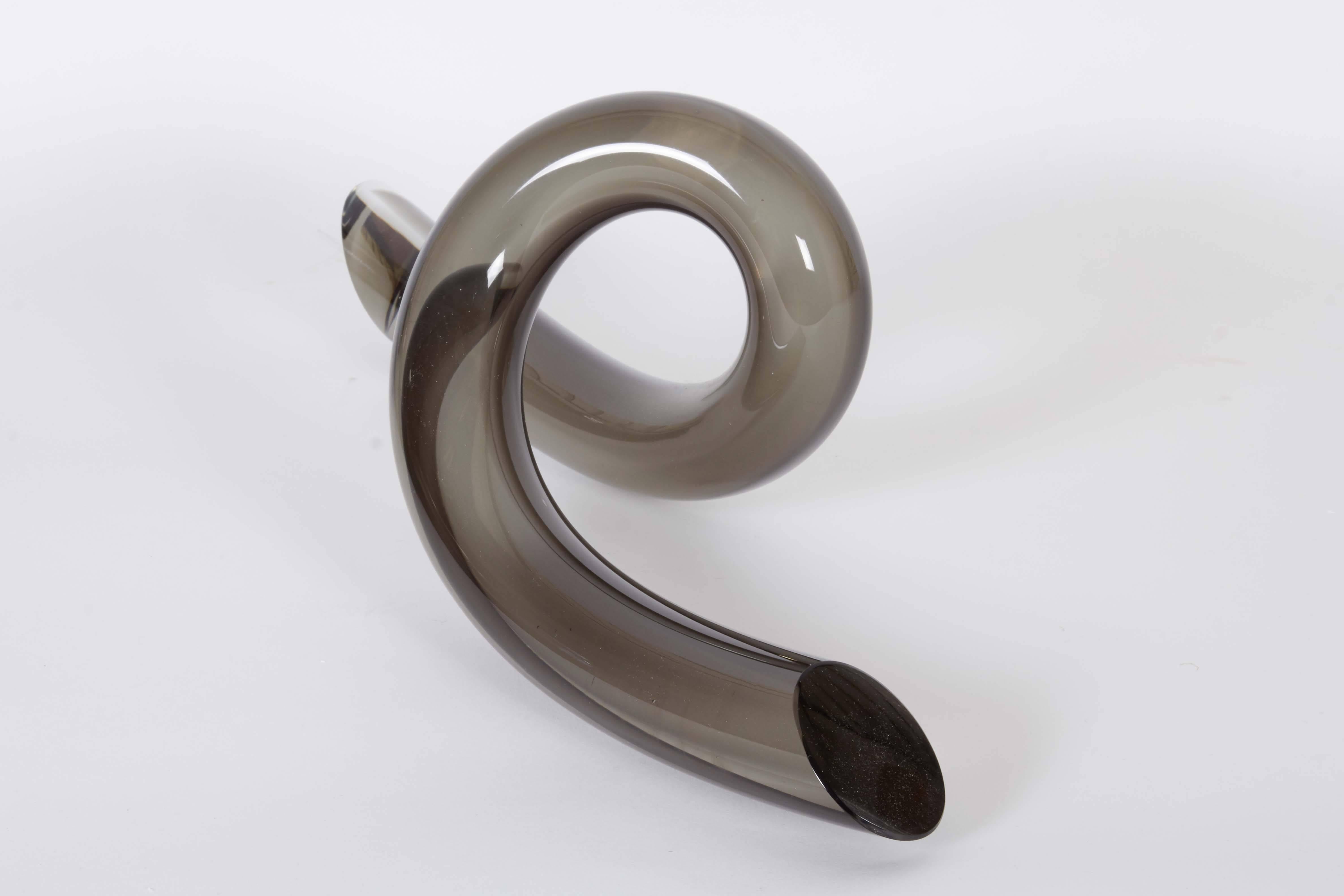 An Italian 'twist' abstract sculpture, produced circa 1970s, of tubular form, crafted of smoked Murano glass. Excellent vintage condition, consistent with age and use.

10933