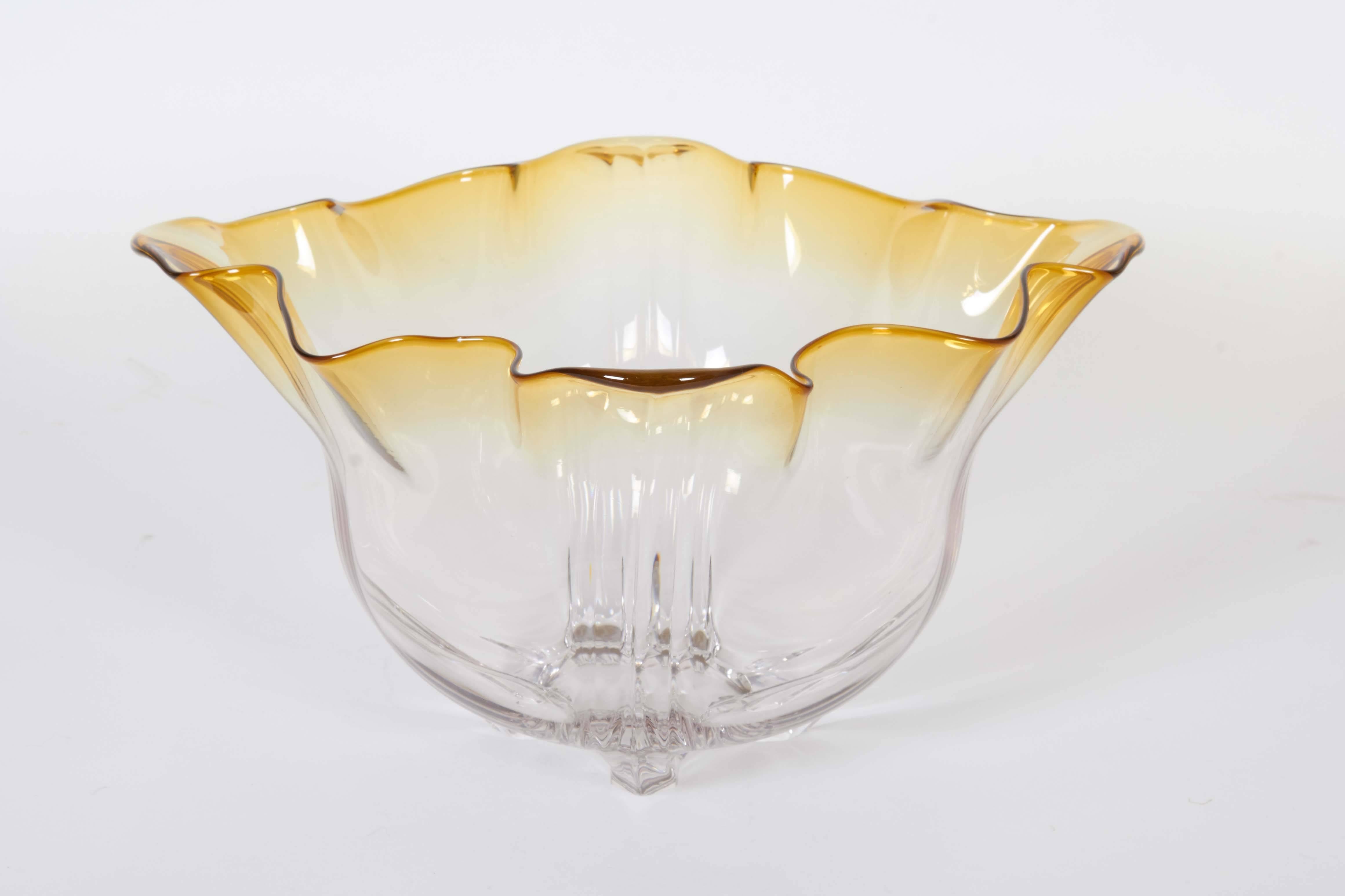 A rare decorative bowl from Frederick Carder's 'Grotesque' line for Steuben, model #7277 produced within the early 20th century era, glass colored amber to clear, highly organic lobed body with flared and ruffled rim. Very good vintage condition,