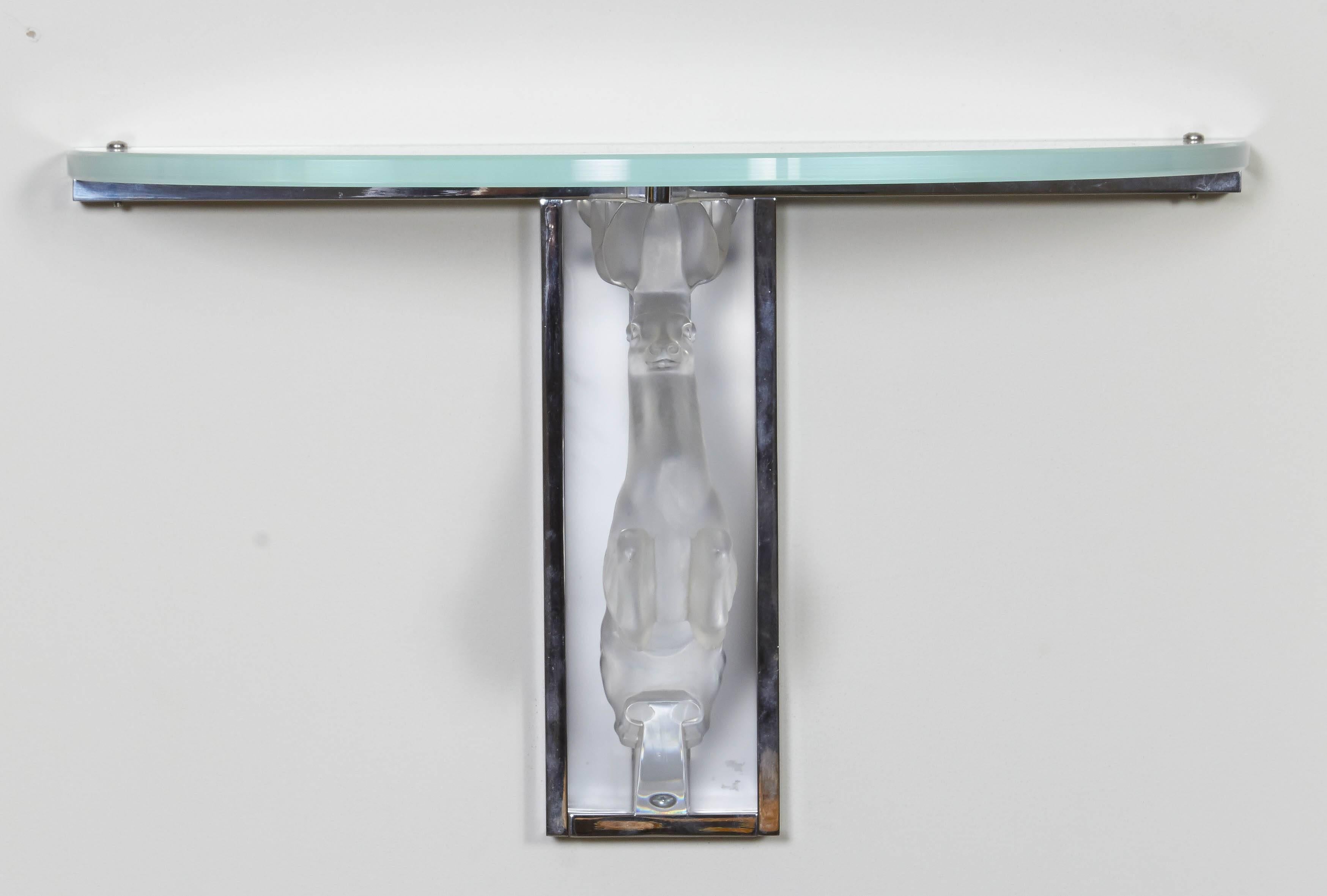 Glass wall console decorated with an antelope.