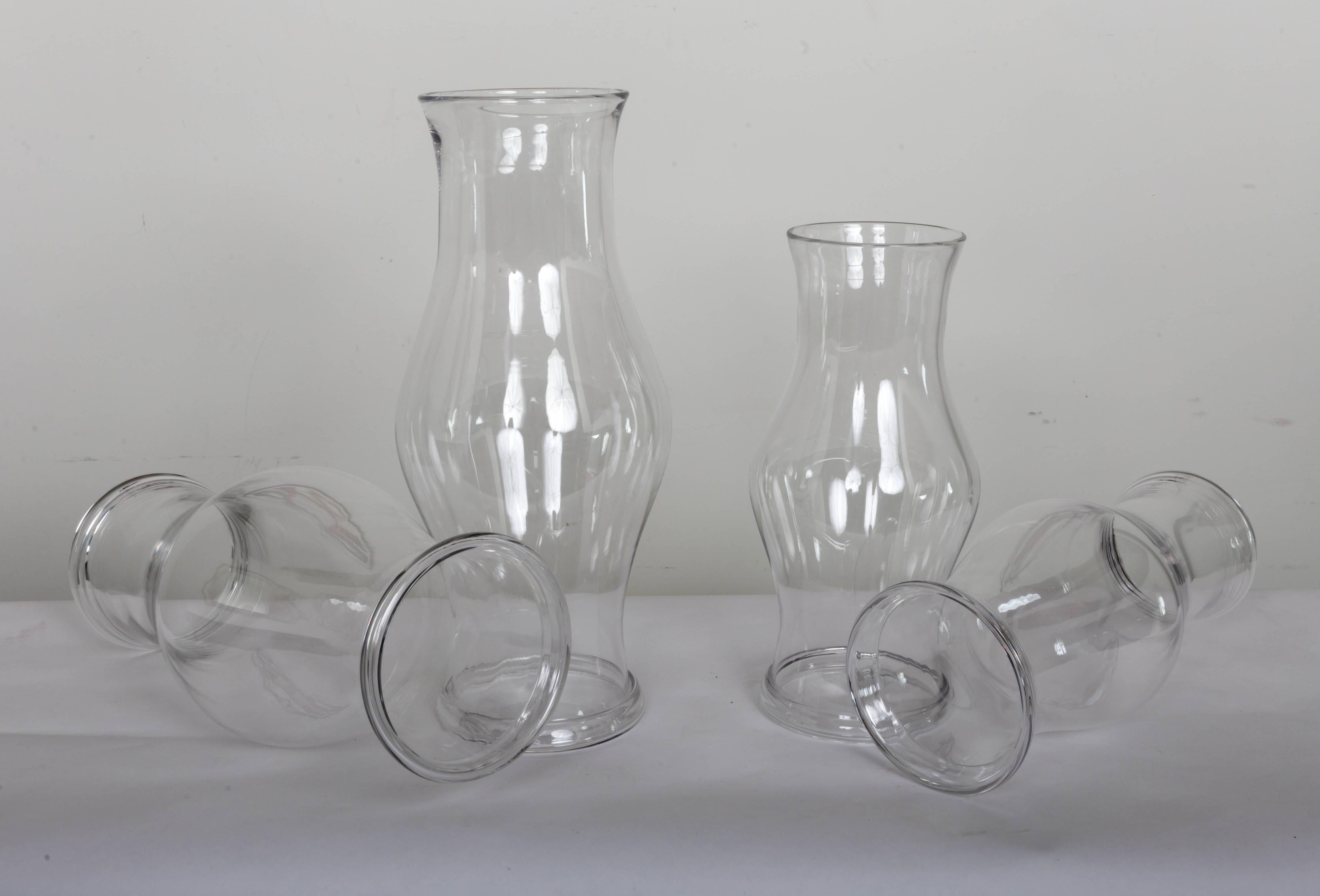 Set of four handblown hurricane shades. Mid-late 19th century. Heavy mantel base.
Measures: Large shades measures 18inch;; H x 8.5inch;(widest) 5 3/4inch; top opening
Small shades measures 14 inch; H x 6.5 inch;(widest) 4 3/4 inch; top opening.